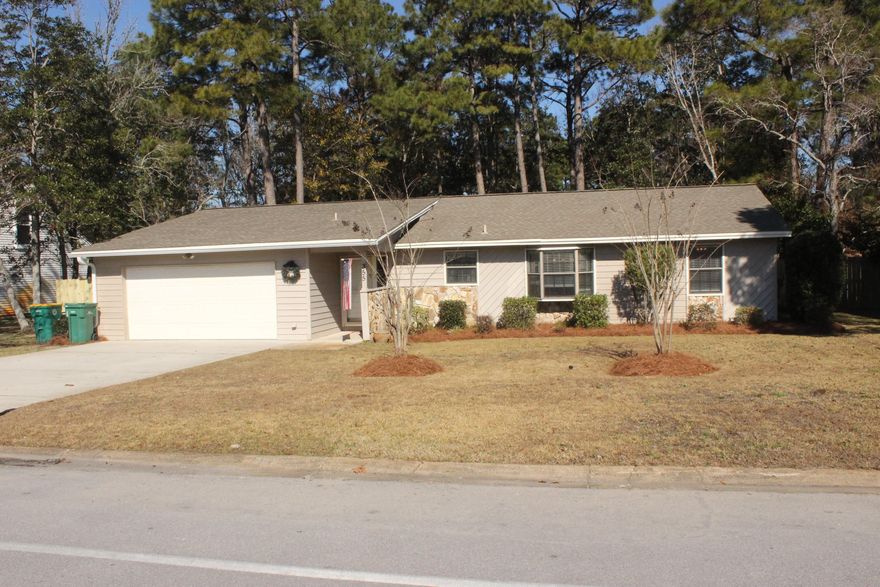 PRICE IMPROVEMENT. This is very well maintained home in the desirable Pinedale neighborhood. It features Tile floors in the living area, kitchen and bathrooms. All bedrooms have new wood grain tile. This home has granite counters in kitchen highlighted with black appliances. The counter tops in both bathrooms are granite. The home has new trim throughout, custom vinyl blinds and Board and Batton Wainscoting in the dining area.