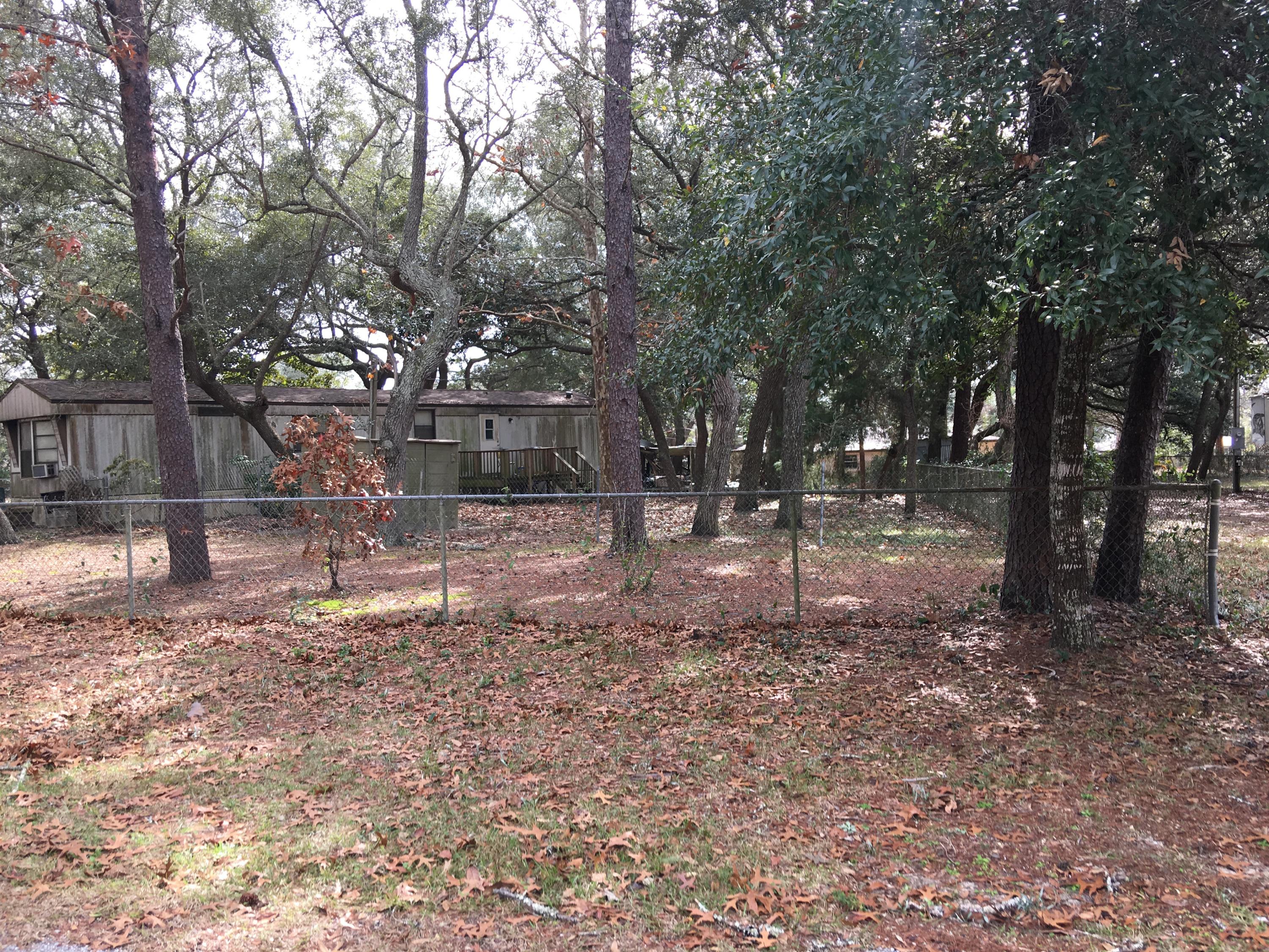 OLDER HOME WITH TENANTS IN PLACE. LOCATED ON A QUIET STREET WITH FABULOUS BAY BREEZE. SHADY LOT. INCOME PRODUCING.LOT 2 IS ONE OF 4 LOTS THAT MAKE UP ONE PARCEL ID. HOME SITS ON LOT 2 AND IS A SEPARATE PURCHASE FORM LOTS 1, 11 and 12.Lot dimension are approximate; sourced from WaltonPA but must be confirmed by Purchaser.