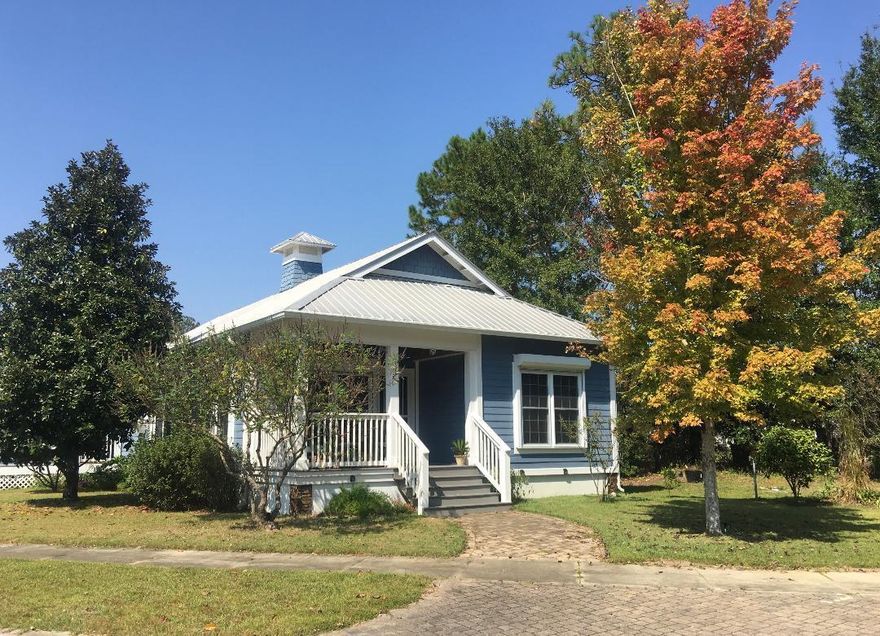 PRICE REDUCED! Beautiful Florida cottage on corner lot in desirable Marina Village. Quality features include a spacious screened porch with Truex stairs, pulldown hurricane shutters, double hung windows and a tankless water heater. The interior has an open concept floorplan, high ceilings and hard wood floors in family and dining areas. Marina Village is a quiet HOA community featuring a neighborhood pool, playground, dog park and stocked fishing ponds for catch-and-release. All this less than a mile from Freeport Marina!