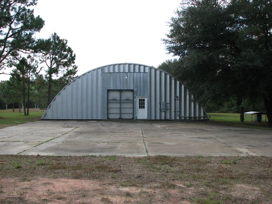 ALMOST 5 ACRES, LEVEL, NICE TREES, AND NOT FAR FROM TOWN. GREAT PARCEL OF LAND TO BUILD HOMESITE ON OR SET UP YOUR MODULAR HOME. THERE IS A 5,000 SQ.FT. QUONSET HUT, WIRED ON A SEPARATE 200 AMP SERICE,PLUMBED FOR AIR AND VACUUM SYSTEM, LOADING DOCK ACCESSIBLE FOR SEMI-ROLL UP DOORS AT BOTH ENDS, 200 FOOT 4'' DEEP WELL FOR THE SPRINKLER SYSTEM THAT IS INSTALLED ON TOP OF THE QUONSET HUT TO KEEP THE ROOF COOL. POSSIBILITIES ARE ENDLESS FOR THIS BUILDING, THERE USED TO BE TWO MOBILE HOMES ON THE PROPERTY BUT THEY HAVE BEEN REMOVED, SEPTIC TANK IN PLACE,TWO WATER METER IN PLACE. BUILDING, SEPTIC TANK AND WELL ALL BEING SOLD AS IS. BROKER HAS OWNERSHIP INTEREST IN PROPERTY.