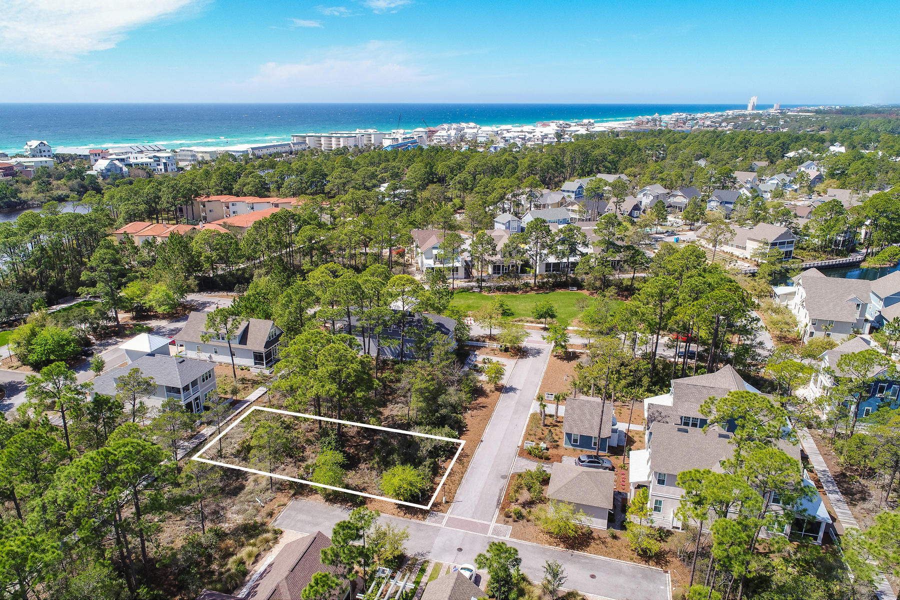 This generously sized building lot 97 at WaterSound West Beach offers the best of all worlds. Sitting on a slightly elevated 0.14 acre lot, your dream home would be caressed by coastal breezes yet just steps from the community pool and private beach access. Tucked beneath a canopy of established trees, you would hardly guess you are in the heart of South Walton. This upscale community has been sympathetically developed to retain a tranquil ambience with secluded homes set in natural surroundings. However, this prime building plot is less than -1/4 mile from the sugar-white sand and glittering emerald waters of the Gulf of Mexico. Even closer to home is Deer Lake State Park. Look forward to spending endless happy days fishing, stand-up paddleboarding, walking the boardwalks
