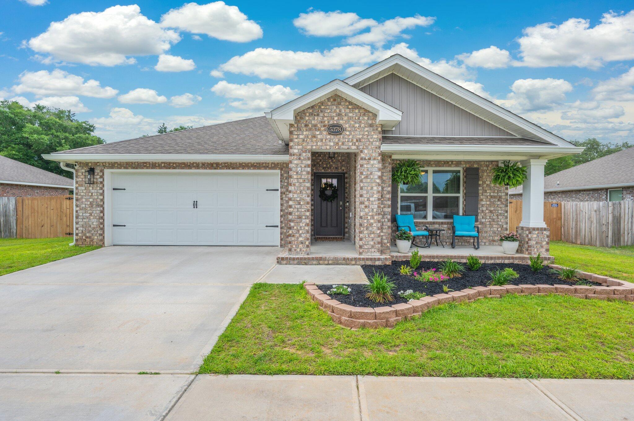 VA Buyers - Take Advantage of a 5.5% Assumable Rate! This stunning 4BR/2BA Cali floorplan is built to impress with an open layout, custom wainscoting, and a spacious living area that flows to an extended patio under a covered pergola. The kitchen is a showstopper--granite counters, stainless steel appliances, breakfast bar, and an ultra-organized pantry. The primary suite is your private retreat with double vanities, a massive walk-in shower, and a dream closet. Even the laundry room is upgraded! Full-yard irrigation and standout curb appeal seal the deal. Don't miss this one--schedule your showing today!