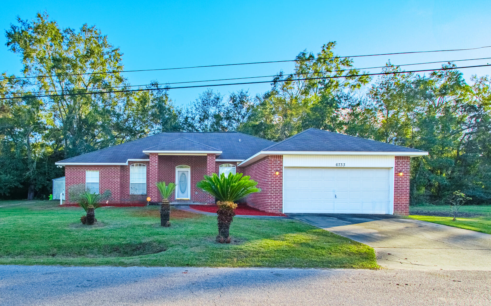 6733 Jackson Lane, Milton, Florida, is a charming residential property nestled in a peaceful neighborhood. HVAC replaced-2023 and hot water heater replaced-2024. This home features a spacious layout with amenities perfect for families or those seeking a serene living environment. The exterior boasts a well-maintained yard with mature trees providing ample shade and outdoor space for gatherings. Inside, you'll find bright, airy rooms, ensuring comfort and style throughout. Conveniently located near local schools, parks, and shopping centers, this property offers both tranquility and accessibility.