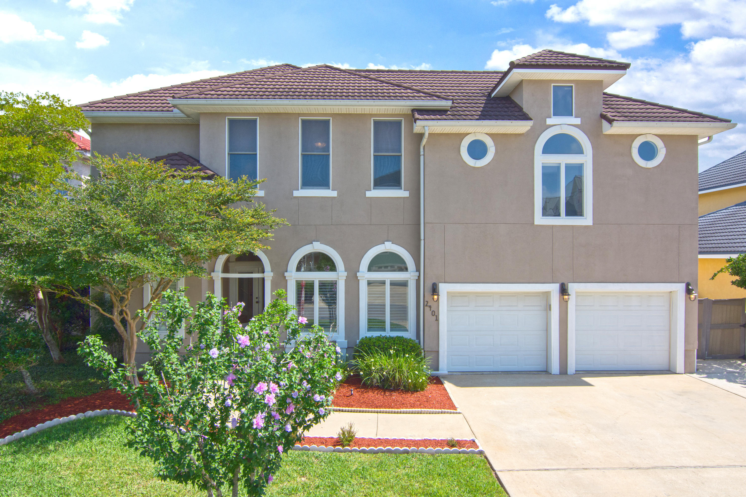 Waterfront property on Garnier's Bayou. Looking to live the salt life? This home has it all, breath taking views of the bayou, a pool, outdoor balconies, grilling area, fire pit, dock with new jet ski lift, 10,000# boat lift and kayak launch. The dock is one of the deepest with a depth of 14'. The home office is located near the front door, the open spacious kitchen flows into the formal dining room. The living room has a gas fireplace and endless views of the water. Imagine waking up to magnificent sunrises overlooking the water and watching dolphins jumping. The house is wired for a smart home with Cat 5 wiring in all rooms and LED recessed lighting throughout. The pool is plumbed for a fountain and has solar heat and outdoor speakers. The home also features a mother in law suite.