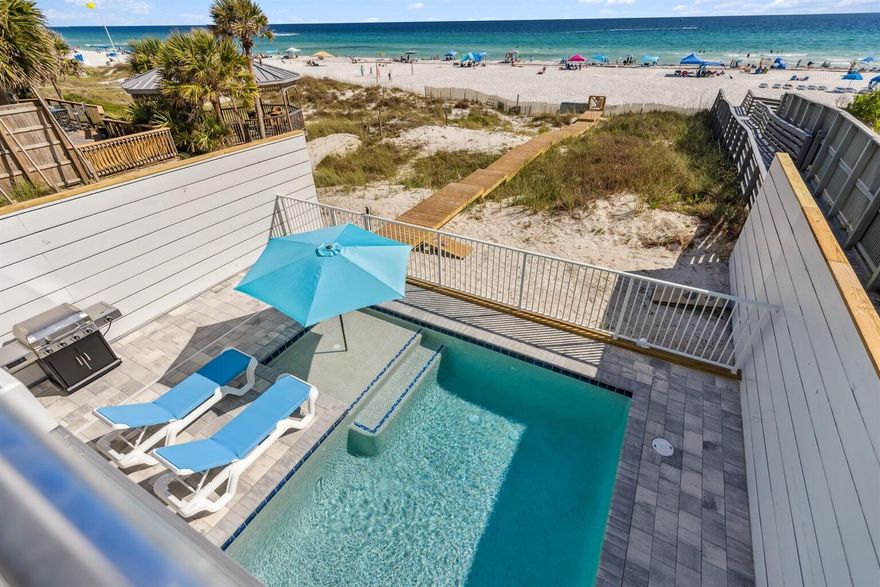 ''Above All'' the ultimate beach house, finished in May! Whether you're investing or just want a place to escape, ''Above All'' is the kind of beach home that checks every box.Freshly styled with over $150,000 of brand-new designer furnishings, high-end accessories, 12 smart TVs, a 412 Game Arcade Console and custom window treatments, this home feels like a luxury resort--only it's all yours With 7 spacious bedrooms, 8 full baths + a half bath, and a smart layout, everyone gets their own space and privacy, making it perfect for big families or group getaways. The main living area has an 30x30 open floor plan that offers a view of the beach from wherever you stand, welcoming with a chef-style kitchen at the center. You'll love the massive 10'x5' Kitchen Island with granite slabs imported from Brazil, dual fridges, wraparound seating, and 75" a wall-mounted TVall facing the water through hurricane-rated windows and a 10' sliding glass door. Step outside and enjoy the kind of outdoor living most people only dream of. A huge 30x25' beachfront deck, not a splash pool, but a heated 12x23' Gulf-front pool with an 8x6' sun shelf. Designed with safety and beauty in mind, the pool is completed with a sleek powder coated aluminum fence that won't block the view, and strong reinforced balcony railings for extra safety. Every living space was design for the utmost in relaxation, entertaining, and simply soaking up the sunsets. This isn't just a pretty faceit's built for the long haul. The first beachfront home on Panama City Beach built on 12x12 concrete pilings (not wood), driven 20 feet deep for unmatched stability and strength. Most fasteners and fittings are made of Stainless Steel, right down to the beach walkway, this house is built to last.  The house is wrapped in Hardie Board siding, secured with stainless screws, and topped with a rust-proof aluminum roof that is sure to last 30 years or more.  
Large hurricane-impact windows and triple-pane Therma-Tru doors bring in the views while keeping you protected. A full commercial-grade fire suppression system, with 24 hour monitoring, adds another layer of safety across all floors and outdoor spaces. And then there's the architectural showstopper: the largest-ever 6x6 Energy Star octagonal window, bringing in beautiful natural light and giving the home a signature, high-end feel you won't find anywhere else. Upstairs, the third floor offers extra guest suites and a bonus living areagreat for movies, game nights, a pool table, air hockey, to give you a little space to unwind after a beach day. And wait until you see the Master Suite, a 16 ft ceiling with Chapel Windows that will carry you away on the clouds.  And to sit and watch the sunset, how about your own personal lounge area with coffee / wine bar! Yours to unplug and unwind in, in this private oasis. Got toys? You're covered with room to park up to 9 vehicles, including jet skis. And best of all? No HOA, no restrictionsjust your own private slice of paradise with the freedom to enjoy it how you want. You're also steps away from all the excitement, including the soon-to-open Tootsies (this will be the closest beach house), Top Golf, and Dolly's Pirates Voyage, with Pier Park just down the road for shopping, dining, and fun. Whether you're looking for a high-performing short-term rental, a family beach compound, or a long-term investment built for the future, "Above All" lives up to its name. Buyer to verify all dimensions.
