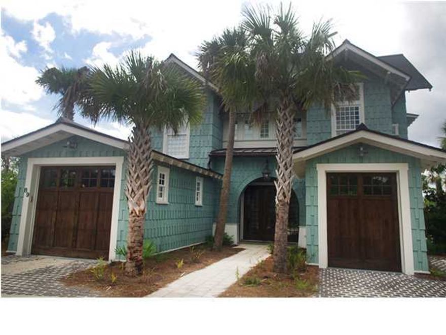 Enjoy magnificent lake, dune and gulf views from this custom retreat in WaterSound Beach on Camp Creek Lake. Designed by architect Matthew C. Savoie and professionally decorated, every detail of this home has been handpicked from the vintage heart pine flooring to the Weathershield Eclipse bi-folding door systems that allow for ultimate enjoyment of the outdoor living spaces and views. The first floor includes two guest bedrooms with en suite bathrooms, a built-in bunk room and a media room perfect for entertaining with a granite bar and built-in refrigerator, freezer and dishwasher drawers. The media room opens fully to the covered patio with fireplace and TV overlooking a charcoal gray Pebble Tec swimming pool and spa with glass mosaic accents. Lush landscaping allows this area to
