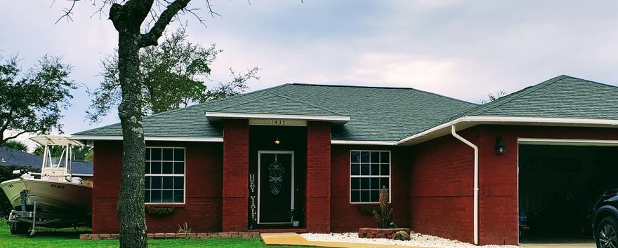 This home is a must see!! This beautiful 3 Bedroom 2 Bath home boasts a beautiful Living Room with a fireplace.  Kitchen has stainless appliances and tile back splash. Tile throughout home.  No carpet!!  Covered Back Porch in a fully fenced Back Yard in order to enjoy the outdoors and a great Laundry Room!  Additionally, there is a 50amp RV hook up and concrete pad.  The fence has been equipped with a cattle gate on the same side as the concrete pad.  A/C 3yrs old. Hot water heater 6yrs old. This property won't last long!