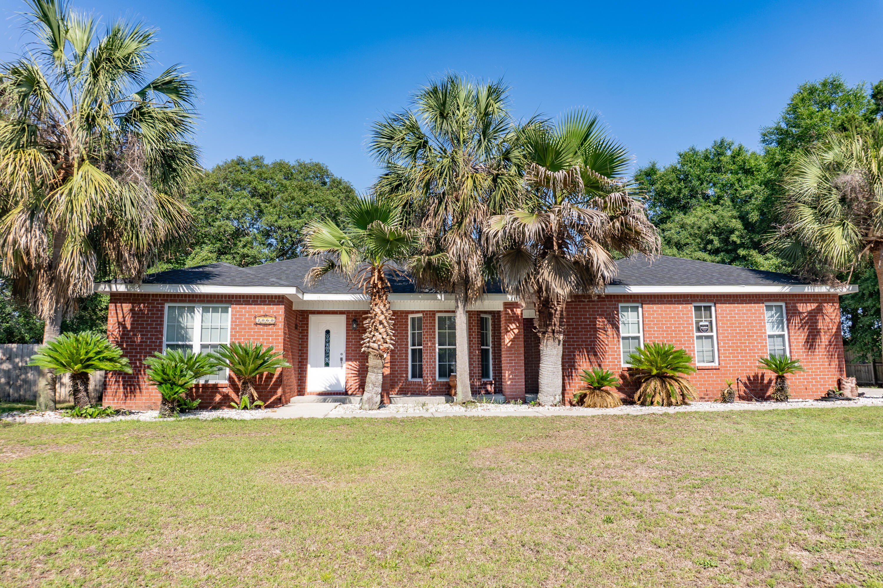 Welcome to Tranquility! This beautifully maintained 3-bedroom, 2-bath all-brick home offers timeless charm, modern comfort, and unbeatable curb appeal. Located in a quiet, established neighborhood, this home shows pride of ownership. Step inside to discover a spacious, light-filled living area with neutral tones and easy-to-maintain flooring throughout. The open-concept kitchen features updated appliances, ample cabinetry, and a cozy dining area that leads to a finished sunroom. Perfect for casual dining or morning coffee. The primary suite offers a peaceful retreat with a private en-suite bathroom and generous closet space. Roof is 3 years old and new HVAC, Water Heater to be replaced soon. Fireplace has an electric insert that is for ambiance but can be upgraded to produce heat.