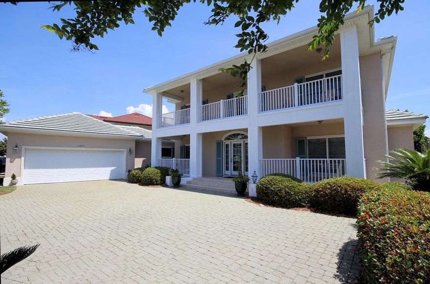 Gorgeous lakefront home located is the desirable Bluewater Bay neighborhood in Sunset Beach. This home exceeds all expectations with its exquisite custom features and extreme attention to detail. Spacious floor plan with a formal dining room and sunny family room just off of the foyer. The family room has recessed lighting and built-in shelving that completely surrounds the fireplace. Glass doors lead from the Family room to a large screened porch that overlooks the lake providing the perfect place to relax over a cup of coffee while catching a breathtaking sunrise. The cook of the family will love the gourmet kitchen with plenty of cabinet and counter space that opens to a convenient breakfast nook. garage with extra space for golf cart. Private Master Suite is on the first floor with a sumptuous master bath that features a garden tub, separate shower and large walk in closet. The second floor has a loft/ sitting area that overlooks the first floor family room with a bedroom suite to either side. Both bedrooms have walk in closets and baths that feature designer lighting/ fixtures, garden tub and a separate shower. There are two large wrap around balconies off of the second floor one on the front of the home that has beautiful bay views and one on the back of the home that offers an unbelievable view over the lake and golf course. This home is finely appointed throughout with upgraded lighting, crown molding, central vac and is a must see for the most discriminating buyer. Sunset Beach homeowners enjoy gated security, yard maintenance, clubhouse with pool; all included in the association fees