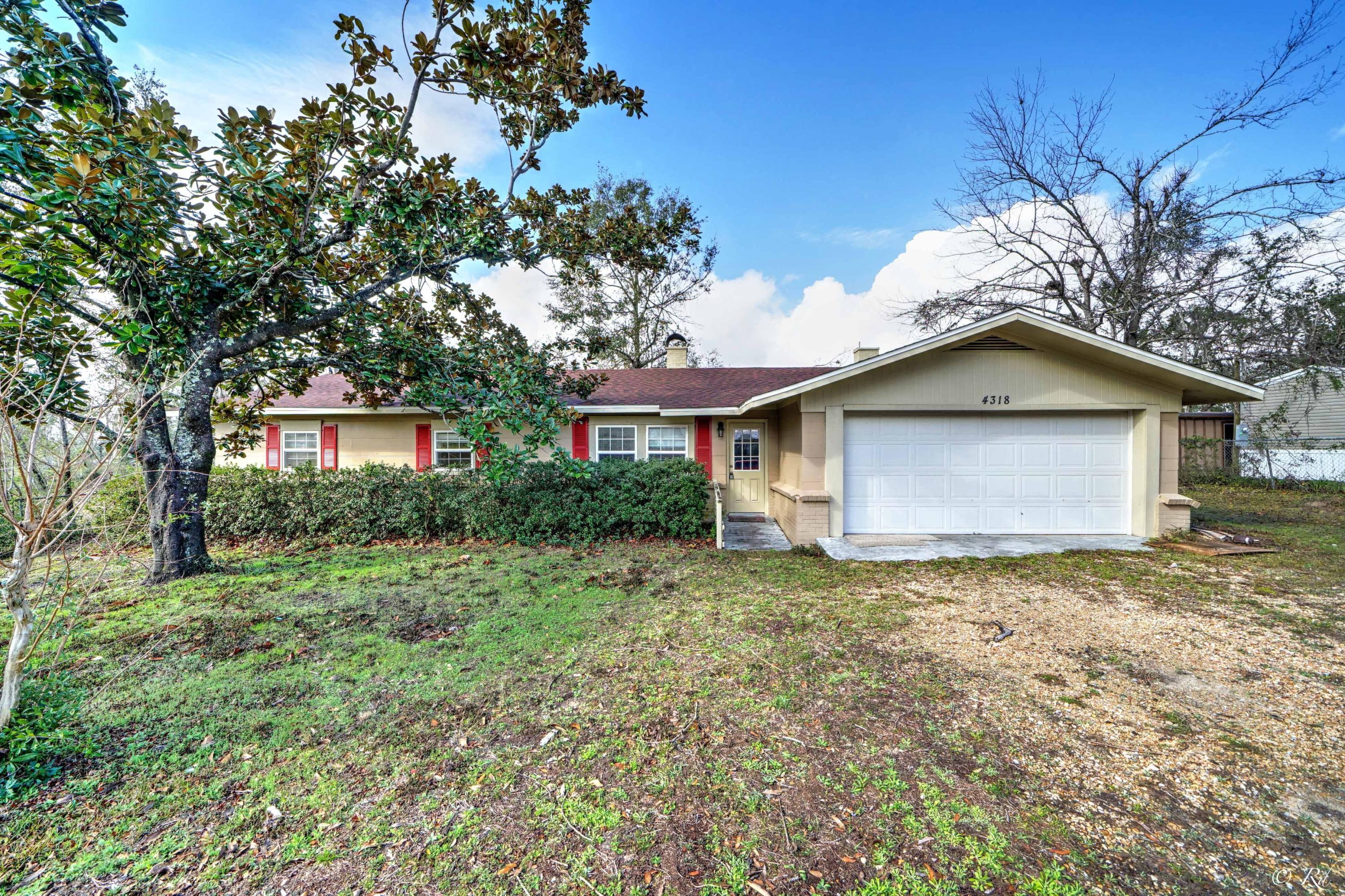 Bask in the beautiful views of the peaceful Deer Point Lake at this 3 bed, 2 bath block home in Southport. The main living area is equipped with a cozy brick fireplace. The bonus room is also equipped with a fireplace and can be used as an office, game room, den and more. The eat-in kitchen features french doors leading to the screened-in back patio, creating an open area that's great for hosting. This home has been repaired with a new roof, septic tank, LVP & carpet flooring, mold remediation, and also has new sheetrock in the North side of the home. The large 2 car garage offers additional space for storage. Appliances will convey including the washer and dryer in the garage.