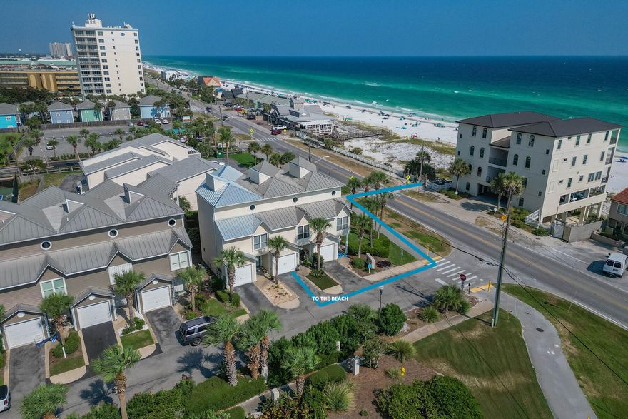 Excellent opportunity to own this renovated townhome with attached one car garage right across the street from the Gulf Of America. This unit has three levels, 9' ceilings, LVP flooring throughout, The first floor boasts a guest bedroom with beverage bar, laundry area, and full bath. A fenced in area on the outside patio can be enjoyed by all including the family pet.  The second level consist of the main living area, kitchen, breakfast bar, and sitting area/second guest bedroom with full bath. Pleasant kitchen decor consists of stone countertops and custom cabinetry. The 3rd level contains a huge master suite with sitting area and gulf views, full renovated master bath, and wet bar. This townhome is perfect as a permanent residence, second home, or vacation/rental. Convenient to beach access, shopping, restaurants, championship going, fishing, and much more.  Buyers to verify all dues and dimensions.