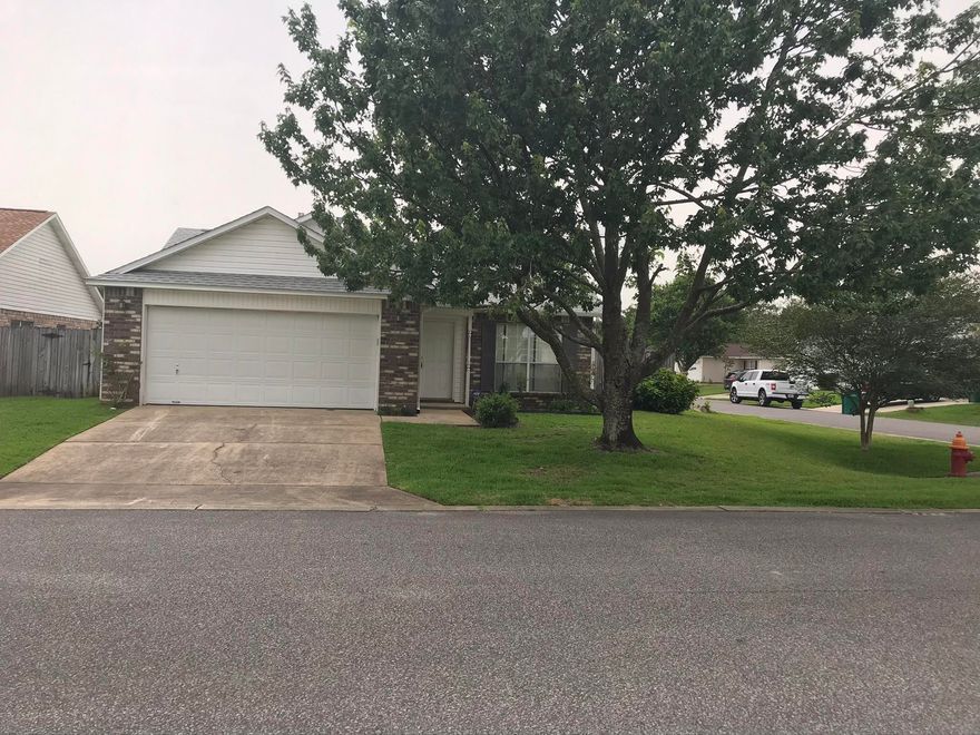 This 3BR/2BA corner lot rental home is one of the best values in Fort Walton Beach and is awaiting your personal touch!
The living room is open and inviting. The kitchen is adjacent to a cozy breakfast nook that overlooks the well-kept back yard through sliding glass doors. It also makes it super easy to keep an eye on the kids or fur babies while they play.
Hard floors in the kitchen and bathrooms give you peace of mind in those areas where spills are most likely to happen. The laundry room is also already equipped with a set of washer and dryer for your convenience.
The master bath boasts a double vanity and a garden tub, and the bedrooms are conveniently tucked away on one side of the house away from the living area
Enjoy outdoor living with an open patio and fenced in back yard fo privacy. This outdoor space is awaiting your summer barbeques. Stroll around the side of the house and you even have your own lime tree. Lawn care is included so this yard space comes with hassle free enjoyment.
This home is just a short drive from our military bases and is also centrally located near schools, medical facilities, shopping and restaurants.
Schedule a showing today!