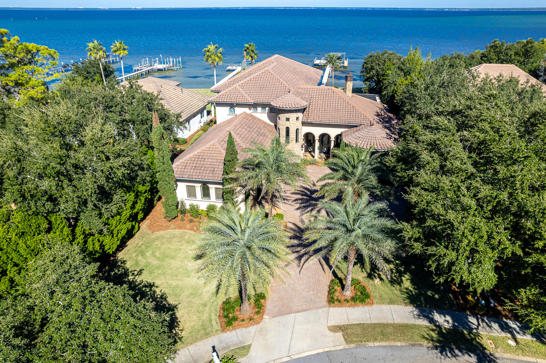 A rare and exclusive waterfront home in the private, gated enclave of Kelly Plantation located in Destin, Florida. 4500 Bellbouy Landing is a trophy estate, constructed, finished, and fixtured throughout to a meticulous standard. Its impressive lot, fronting the scenic Choctawhatchee Bay, expands 103' along the tranquil waterfront setting, while the enormous, estate-sized lot contains lush, mature landscaping and fabulously maintained grounds. The 6-bedroom, 6-bath home measures approximately 6,506 square feet of conditioned space, while the total improved square footage is approximately 8,402 square feet. Custom-designed and constructed in 2010 by the legendary homebuilder, Don Keener, this Tuscan-style masterpiece was the awarded spotlight of the 2010 Parade of Homes. The...