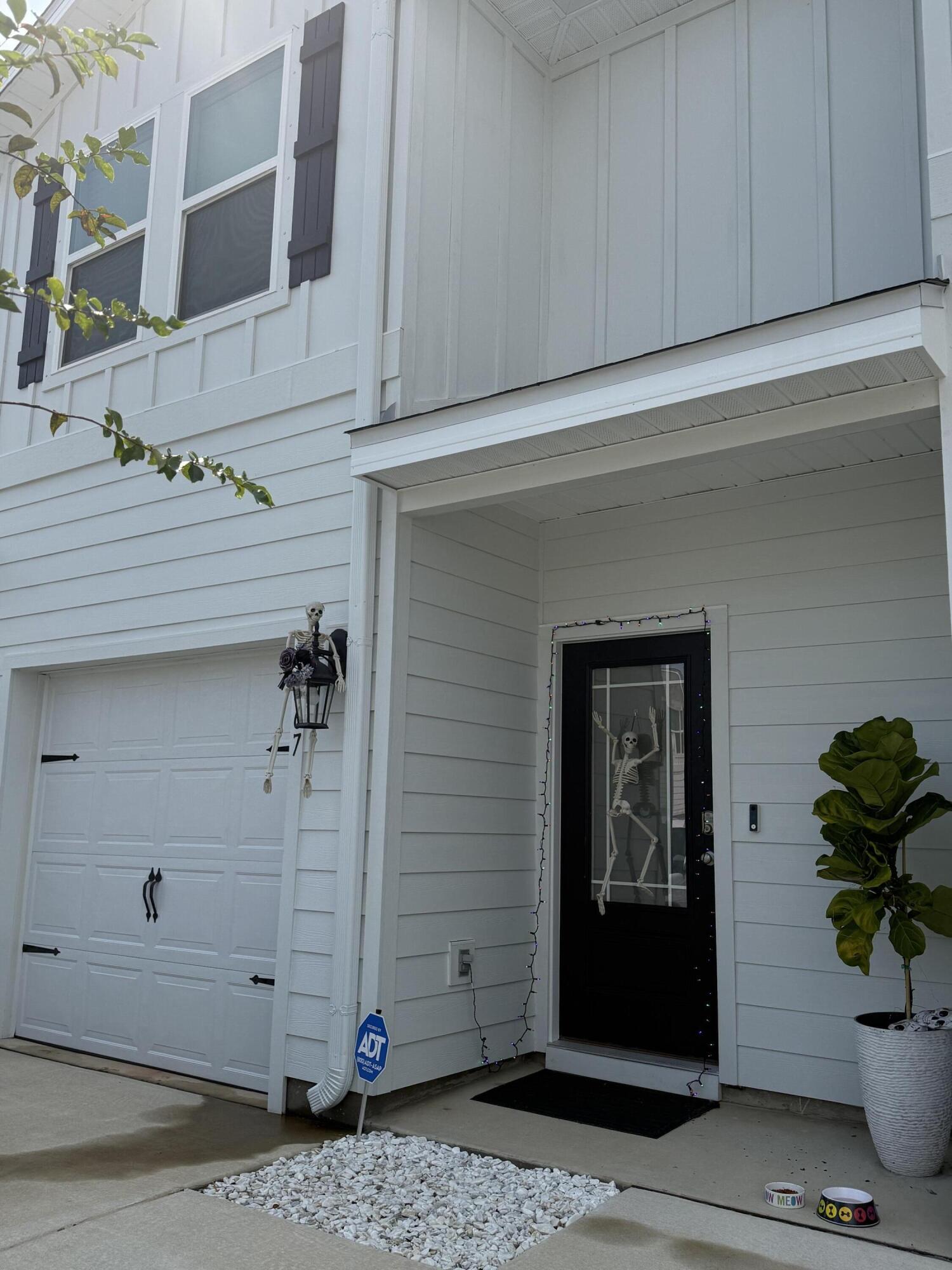 This extraordinary townhome, nestled in the highly coveted Ward Crossing neighborhood, embodies an unbeatable location that will elevate your lifestyle. Not only is it just a stone's throw away from the new Panama City Beach Hospital and Medical School, one mile to be exact, but it's also merely 3.3 miles from the breathtaking white sand beaches along the prestigious Emerald Coast. Moreover, its proximity to the Northwest Florida Beaches International Airport, only 14 minutes away, will connect you to endless possibilities! With its unparalleled access to an array of exceptional restaurants and shopping in Pier Park, just 5 minutes away, this location will inspire a life full of convenience, adventure and tranquility all in one! Now that we know the location of the townhouse is truly incredible, let's dive into the fantastic features it has to offer! Tucked away on Melrose Way, where serenity and tranquility await, with picturesque wooded views from the back, this three bedroom, two and half bath townhome boasts stunning luxury vinyl flooring all the way through - no carpet! It has exquisite granite counter tops, a spacious floor plan perfect for entertaining or unwinding, and is a true haven for relaxation! There's also a beautiful patio area in the back, beckoning you to unwind and relax! This townhome is a Smart Home that features electronic door locks, lights, temperature control, water detection and a garage door opener, all from an app on your smart phone! It also has a water filtration system and has a remaining Builder's warranty through December 27, 2025, giving you peace of mind and freedom from worry! This property has everything you are looking for!