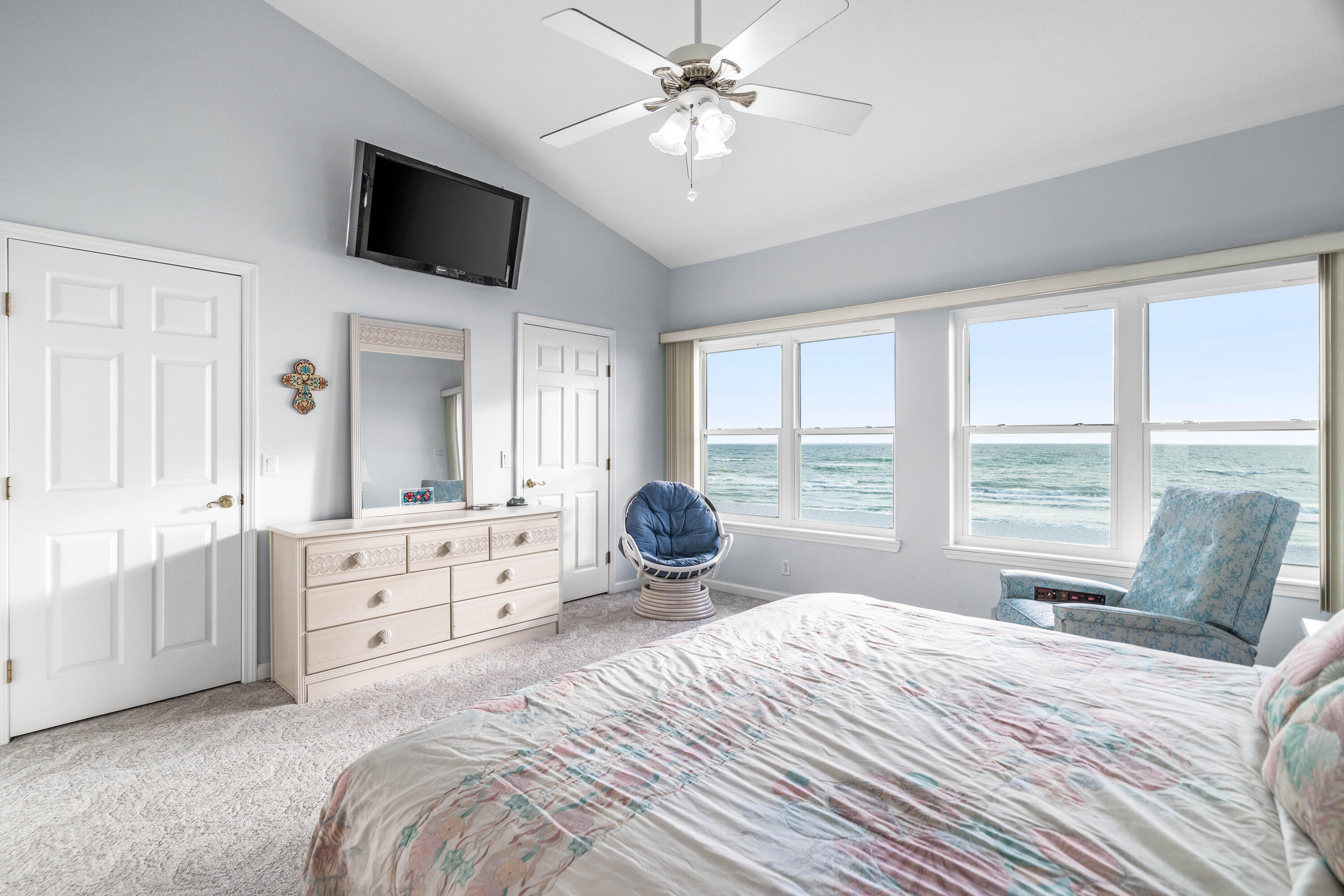 Move right in and start enjoying all that peaceful coastal living has to offer. This is impressive an amazing gulf-front townhome with 2 bedrooms and 3 bathrooms and loads of character. You will notice the breathtaking panoramic views from the moment you enter. With vaulted ceilings paired with the open floor plan it was clearly designed to keep all of nature's elements in sight. Enjoy brilliant sunrises as well as exceptional dolphin spotting from the 180-degree open water views of the Emerald Coastline. Recent upgrades include: New storm windows 4/22, downstairs flooring 11/21, and AC unit 12/20. The inviting family room which looks out onto the water is adjacent to the kitchen and provides the perfect space for seamless entertaining. The kitchen is large and spacious. A gorgeous tile