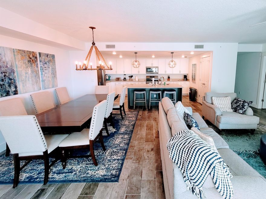 ATTENTION INVESTORS:  Over $166k in gross bookings in 2022 with several week remaining- potential for $170k+.  $150k in gross bookings in 2021.  See documents for details. Unit 100 is an expansive 1957 square feet of heated and cooled space.  This unit has the largest master bedroom, kitchen, & living/dining area of any plan at Blu!   You and your guests will enjoy a huge gourmet kitchen with an over sized dining area and eat in bar!  This flows to an over sized living room complete with a Smart 70'' TV. Three large bedrooms each with on suite baths and 55'' Smart Samsung TV's provide excellent comfort.  The master bath has a spa like tub and separate shower!  In addition, the media room was converted into a fourth bedroom with a queen over queen custom bunk bed.