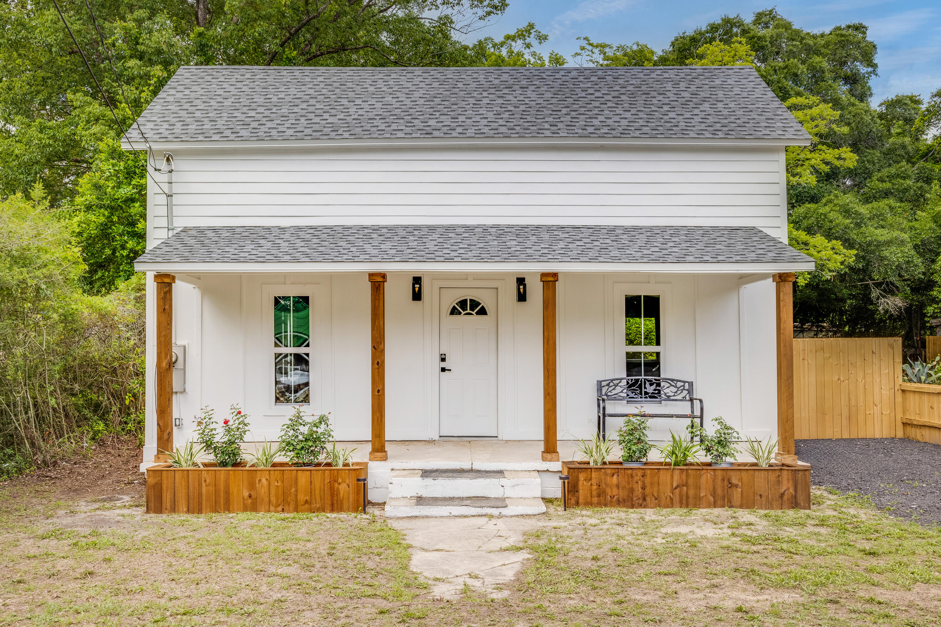 Charming, fully remodeled 1900 home blending timeless character with thoughtful modern updates. This 3 bedroom, 1 bath two-story home features Hardie board siding, stained front columns with built-in planters, and LVP flooring throughout. Enjoy the eat-in kitchen with all new appliances. Original upstairs ceilings add character, while a fenced backyard with mature trees offers privacy. A storage shed provides space for tools and yard equipment. Conveniently located one mile from bustling downtown DeFuniak Springs, where you'll find a variety of shops and dining options, as well as the beautiful Lake DeFuniak, and just 30 minutes from the sugar-white sand beaches of South Walton and 30A. A perfect blend of comfort and convenience, this home is an ideal starter home or retirement retreat.