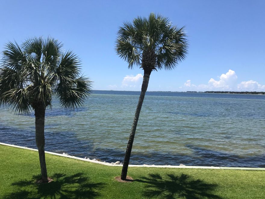 Must see waterfront condo. Come home to the best views Finisterra has to offer. Panoramic view of the Choctawhatchee Bay. You can see Destin fireworks from your private balcony. Two bedroom, two bath condo with cork flooring. Tile in kitchen & bathrooms. Nice size living and dining area with two large windows overlooking the water. 5 minutes to Eglin AFB. Pool, community room, and laundry facility directly across the street from this unit. Assigned parking space is an end spot. Gated complex. HVAC brand new! Water heater 2015