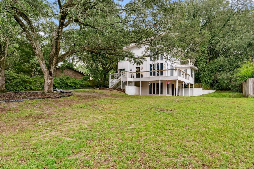 3.75% assumable mortgage to qualified buyers. This is quite possibly one of the most beautiful and uniquely designed homes in theNiceville area. Let all the Florida sunshine come in through the floor to ceiling windows and shine on the golden bamboo flooring (newer). You will be pleased with the open concept kitchen with granite counter tops and an abundance ofcabinets. The siding is made of sturdy fiber cement siding and the home has multiple levels of balconies, decking and covered patios, surroundedby beautiful mature trees, peek-a-boo water views & fenced back yard with a large workshop. Bottom level has a separate entry that could possiblybe used as an apartment or in-laws quarters.4 Point shows: Re-plumbed PEX 2021. Roof 2014 3D shingles. *See attached report