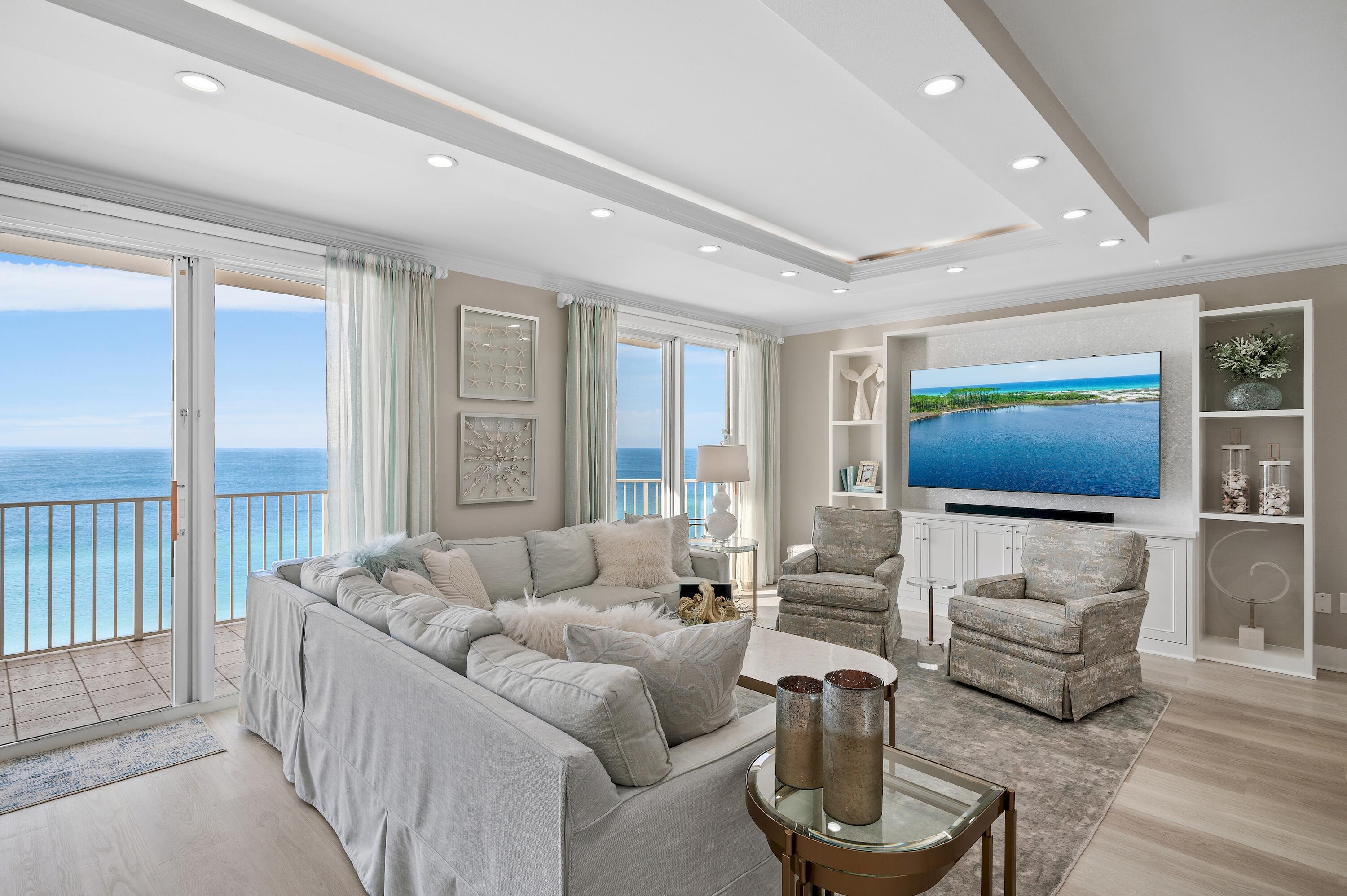 This exquisite, completely renovated penthouse at Majestic Sun will absolutely take your breath away. Situated on the 12th floor, the expansive Gulf views are simply stunning. Offering 3 bedrooms and 3 baths spread through a spacious 2,212 square feet, the unit went through a quarter million dollar renovation in 2021/2022 designed and furnished by the renowned Risa's Interiors. It's expansive upgrades include quartz countertops throughout, new flooring throughout, remodeled kitchen with new cabinets, island and all new LG appliances, custom entertainment center, all new lighting fixtures, new HVAC system, electronic shades in the den, custom draperies in master with custom plantation shutters in guest bedrooms, fresh paint with new trim and baseboards, custom closets, new televisions,
