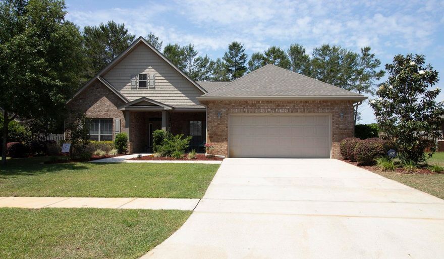 all brick home nestled on a fantastic lot with views of the pond. Four bedrooms plus a private office. As you approach the covered porch you'll be delighted by the welcoming featured columns and space for a few rocking chairs. Welcome home, to your left is the office, large enough to make a den or play room. As we enter back into the foyer you will notice the new engineered hardwood flooring that flows throughout the home into the formal dining room to the left and into the large family room featuring cathedral ceilings and large windows overlooking the back yard. Enter the kitchen from the dining room or family room. The kitchen is large enough to add a center island if you like. Boasting plenty of cabinets and granite countertops. Kitchen appliances including the built-in microwave