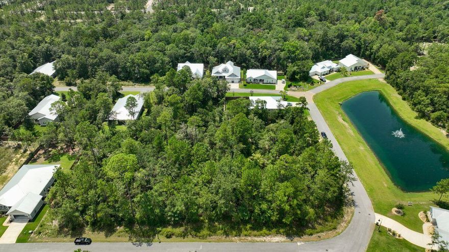 Set among mature trees, this homesite in Bear Creek Cottages offers the chance to build in one of Freeport's most sought-after neighborhoods. Ideally located just north of the bay, the property provides easy access to beaches, golf, shopping, and top-rated schools. Residents enjoy a host of community amenities designed for both relaxation and recreation, including a pool, playground, and courts for tennis, basketball, and pickleball. An excellent opportunity for a primary residence or vacation retreat, attractively priced for today's market.