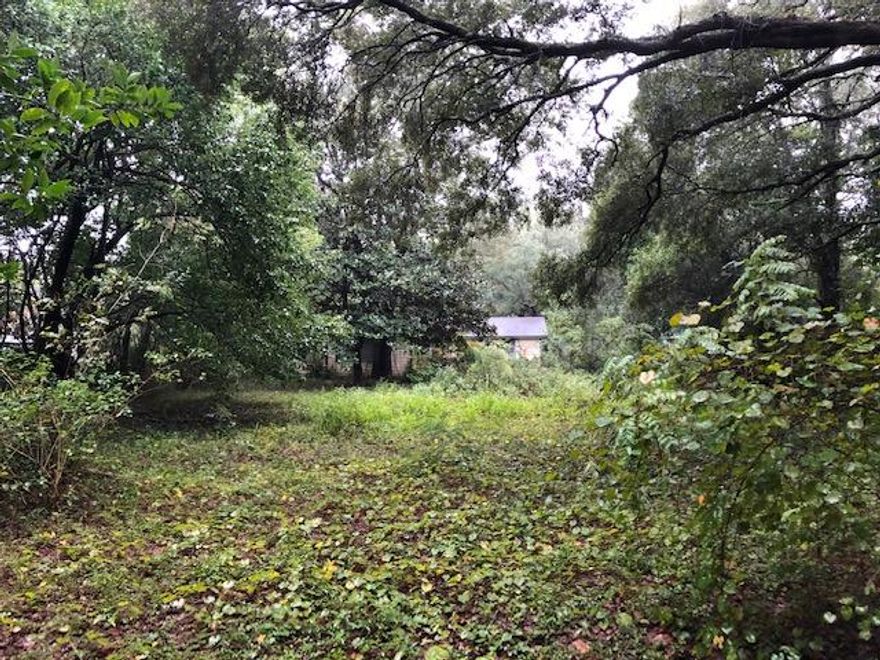 Dream property for investors or builders. Large wooded lot (.36 acres) with abandoned home which is not habitable. This property is situated in upscale neighborhood just off Lewis Turner Blvd. and near Fort Walton Beach Golf Club. Priced to sell as vacant lot, though the home on the property has been vacant for years. Room measurements, square footage and lot dimensions are best calculations based on information provided. Buyer needs to verify if important. Please use attached contract in documents.