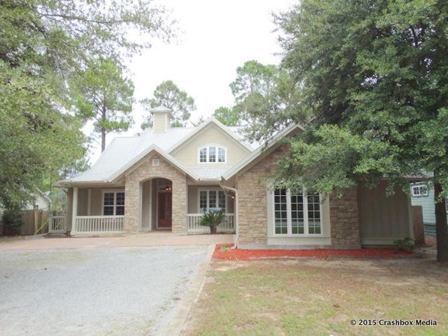 REO SALE!! This is a really unique 4 bedroom, 2.5 bath home that is only a few blocks from the bay and a short distance to Grayton Beach, Seaside, Watercolor and the beach. The split-bedroom, open floor plan home features arched doorways, decorative concrete floors, granite counters, trey ceilings, recessed lighting, and contemporary detailing. Notable features include a fireplace in the living room, screened porch with outdoor kitchen and fireplace, and master suite with en-suite bathroom and walk-in closet. The home has tons of curb appeal and fabulous features. Call your agent today!