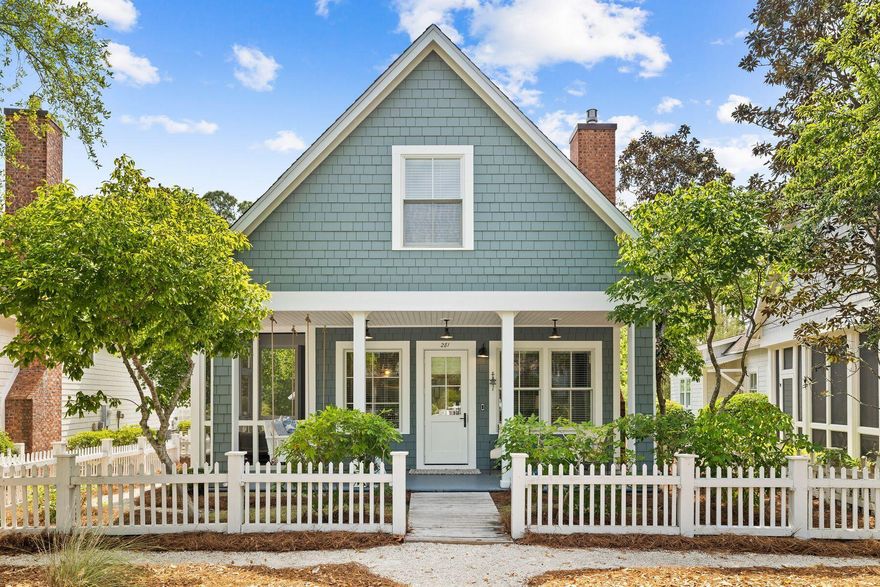 Set behind a white picket fence, this coveted Nantucket-style beach cottage is currently the lowest-priced home in WaterSound Beach. Close to extensive amenities and the private beach that WaterSound is known for, this charming home conveys with high-end furniture, a golf cart, and kayaks. Sitting on a generous lot, there's a detached garage and ample space to add a private pool. The front porch is perfect for relaxing or reading on the custom porch swing. Step inside to find a cozy sitting room with new hardwood flooring, soaring ceilings and white wainscoting surrounding a cozy brick fireplace. Multiple windows showcase pretty garden views. The dining area flows directly into the kitchen with a breakfast bar providing additional seating when entertaining.