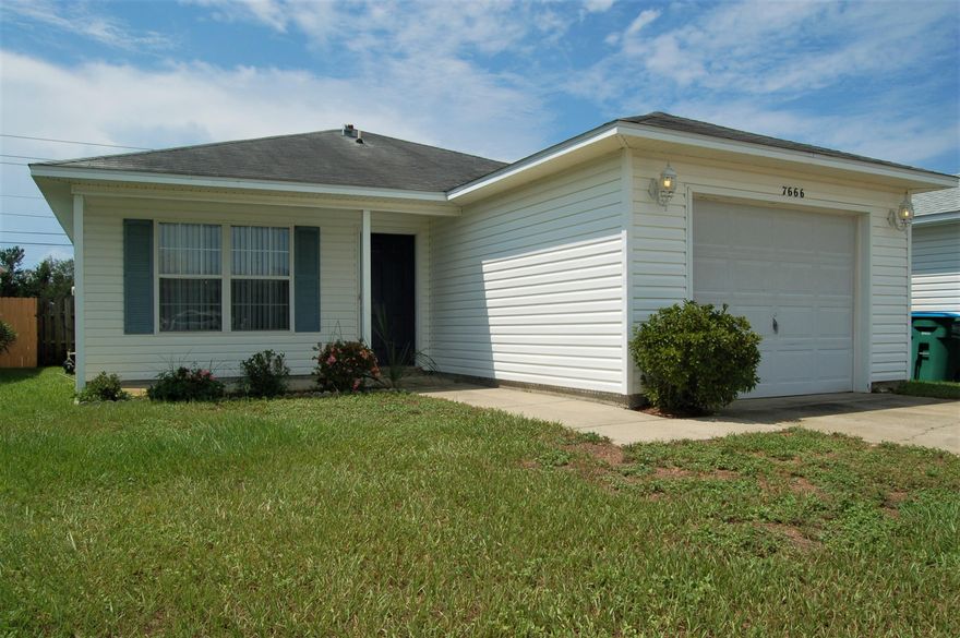 Spacious living room with open floor plan, 3 bedroom two bathroom home close to the beach, Hurlburt Field, Eglin Airforce base, schools, and shopping center.