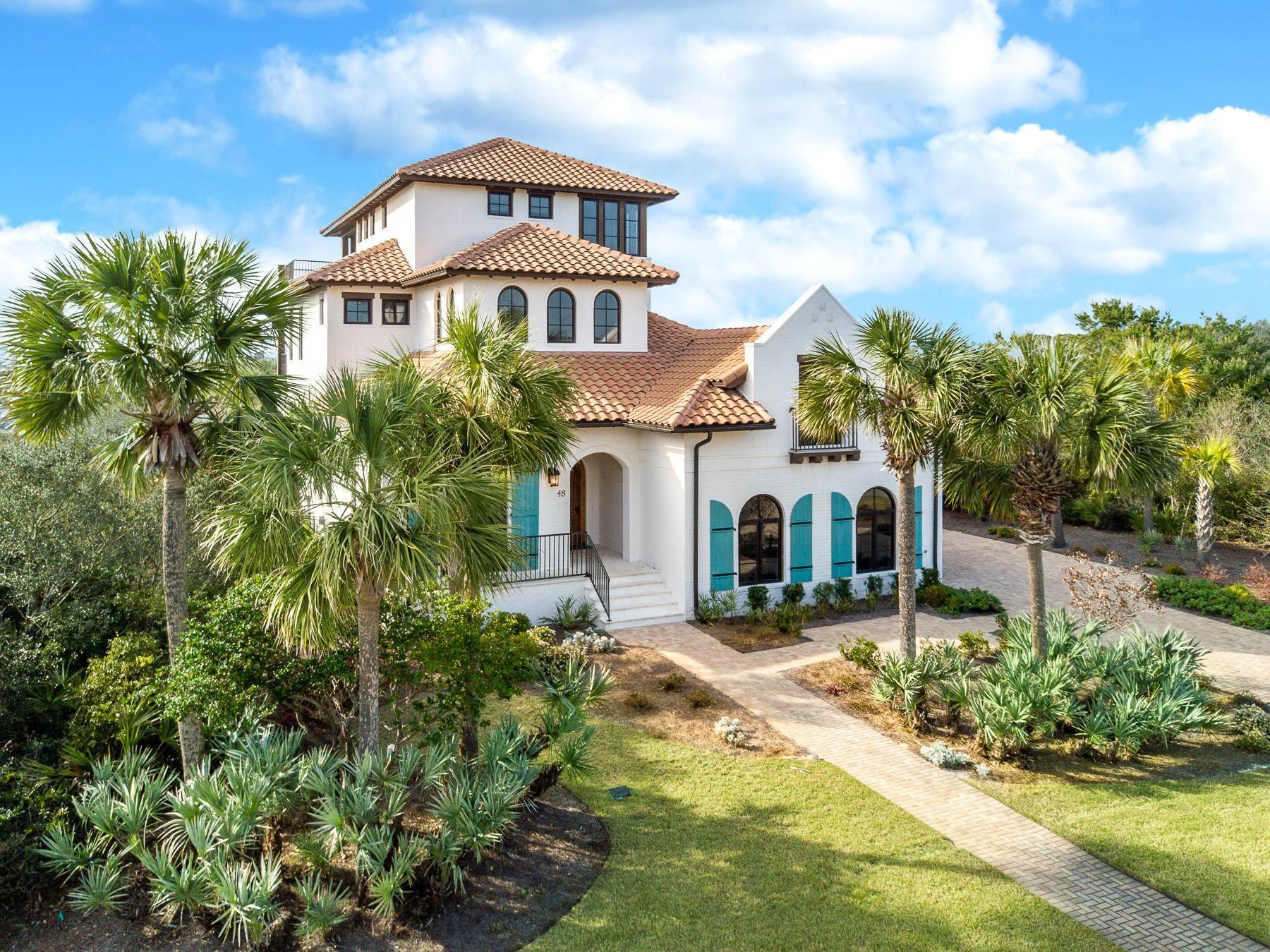 Beautiful Mediterranean style home in the private gated neighborhood of Paradise by the Sea. This home was custom built in 2015 and has all the upgrades today's buyers wish for. The large master suite as well as the main living area are found on the ground level. The open concept kitchen/living/dining area opens to a backyard oasis through a wall of glass sliders. A summer kitchen and large outdoor dining area lead to home's luxurious and unique private heated pool and spa. The home sits on just over a 1/4 acre lot and is full of beautiful tropical landscaping. Paradise By the Sea is home to some of the most private stretches of beach on 30A, nestled between Rosemary and Alys Beach and in walking distance to all the shopping and dining of Rosemary, Seacrest, and Alys.