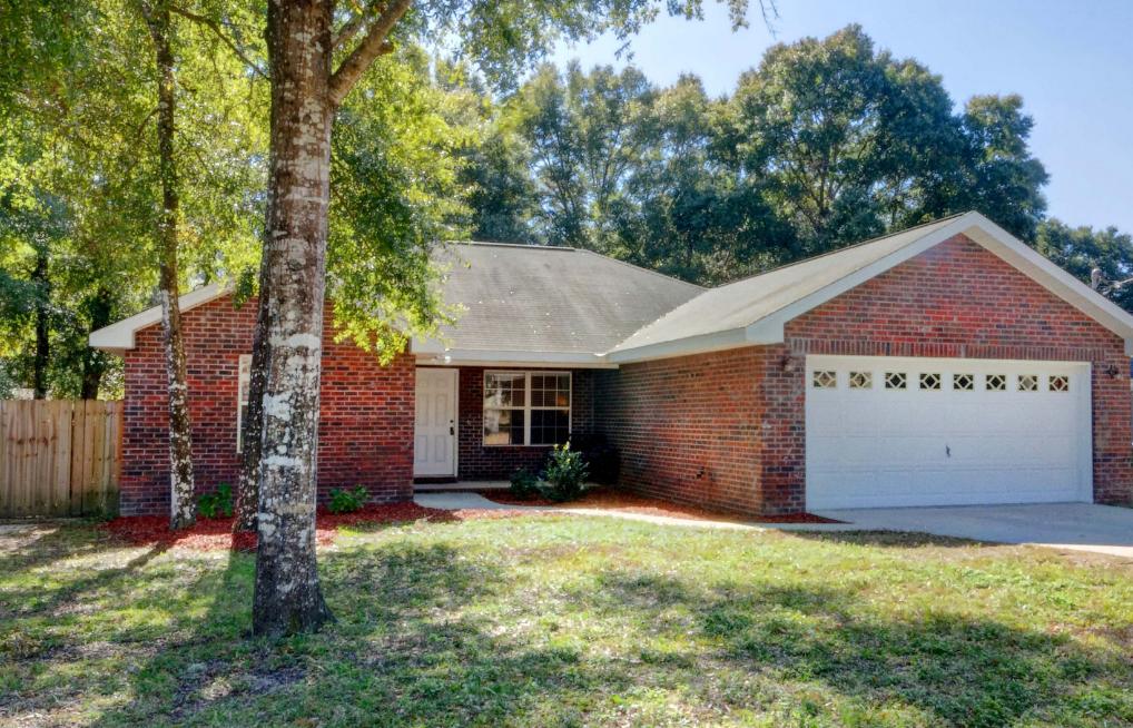 This is THE ONE! A Beautiful, Spacious, all Brick Home offering desirable Split Bedroom plan! Amazing features include High Vaulted ceilings in the Living Room, the eat-in Kitchen comes equipped with new (2015) Stove and side-by-side Refrigerator, Ceramic Tile Flooring, large Breakfast Bar, Counter and Cabinet Space galore, Beautiful Oak Cabinets and a Pantry. The large Master Bedroom has a large Walk-In Closet and His & Hers Vanity in the Master Bathroom. The 2nd and 3rd Bedrooms are spacious with ceiling fans in each room. Step out back onto the Covered Patio perfect for grilling, overlooking the huge newly fenced in backyard, perfect for kids, Pets or Entertaining around the Fire Pit with Privacy! 2 Car Garage. This is truly a MUST SEE!. Contact us Today to Schedule a Showing!