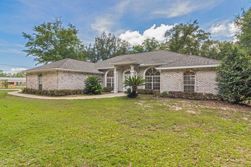 Gorgeous well maintained home in North Crestview. This home is within walking distance of Bob Sikes Elementary and 25 minutes to 7th Special Forces Group just south of Crestview. The home features and huge flat acre lot and detached workshop/garage. Just inside the front door you will find brand new wood laminate flooring throughout and a beautiful gas fireplace. The kitchen has lots of cabinetry and a large pantry. Brand new stainless appliances were just added as well. This home features the ever popular split floor plan and large spacious bedrooms. The master bath has two vanities and two walk in closets. A jacuzzi tub and separate shower are perfect for relaxing and washing off the day. A 30 foot long screened in patio can be find just outside the back door. Great home and Great Buy!