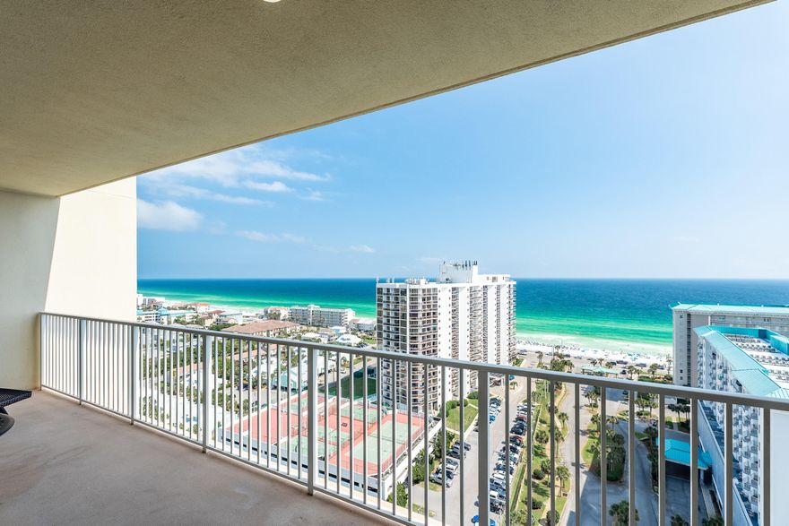 Enjoy sweeping,breathtaking views of the white beaches,  gulf and coastline from this immaculate 18th floor unit with newer furnishings. The 6'x25'private balcony  can be accessed from the living room or master bedroom.  Beautiful granite enhances the gorgeous cabinetry which is fully furnished.  Breakfast bar adds additional seating. Tile flooring flows from the entrance thru the living room and LVP has replaced the carpeting in both bedrooms.  Garden tub with a separate shower in the master bathroom while a combination tub shower in the guest bathroom.  Laundry room is equipped with a new stackable washer and dryer,  Complex has two pools( one heated in winter months). A 9 hole golf course, fitness center, tennis courts2000' of deeded beach access. Concerts throughout the year are held across the street.  Make sure you add this to your list to view....you won't be disappointed.  