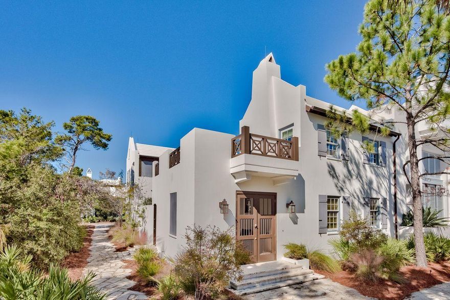 An ideal beach retreat, this 3 bedroom courtyard style home offers a spacious living area perfect for entertaining and gatherings. Upon entering through the zaguan, the courtyard opens to a private pool and steps to a roof terrace with outdoor fireplace. The first floor offers a living room with gas fireplace, dining room, and open concept kitchen. The second floor features a master suite with French doors, opening to a balcony overlooking the courtyard, as well as a generously sized guest room with en suite bathroom. A third bedroom is located in the detached guest suite off of the home's private terrace, which additionally overlooks the courtyard and pool. The home also features 2 garages.