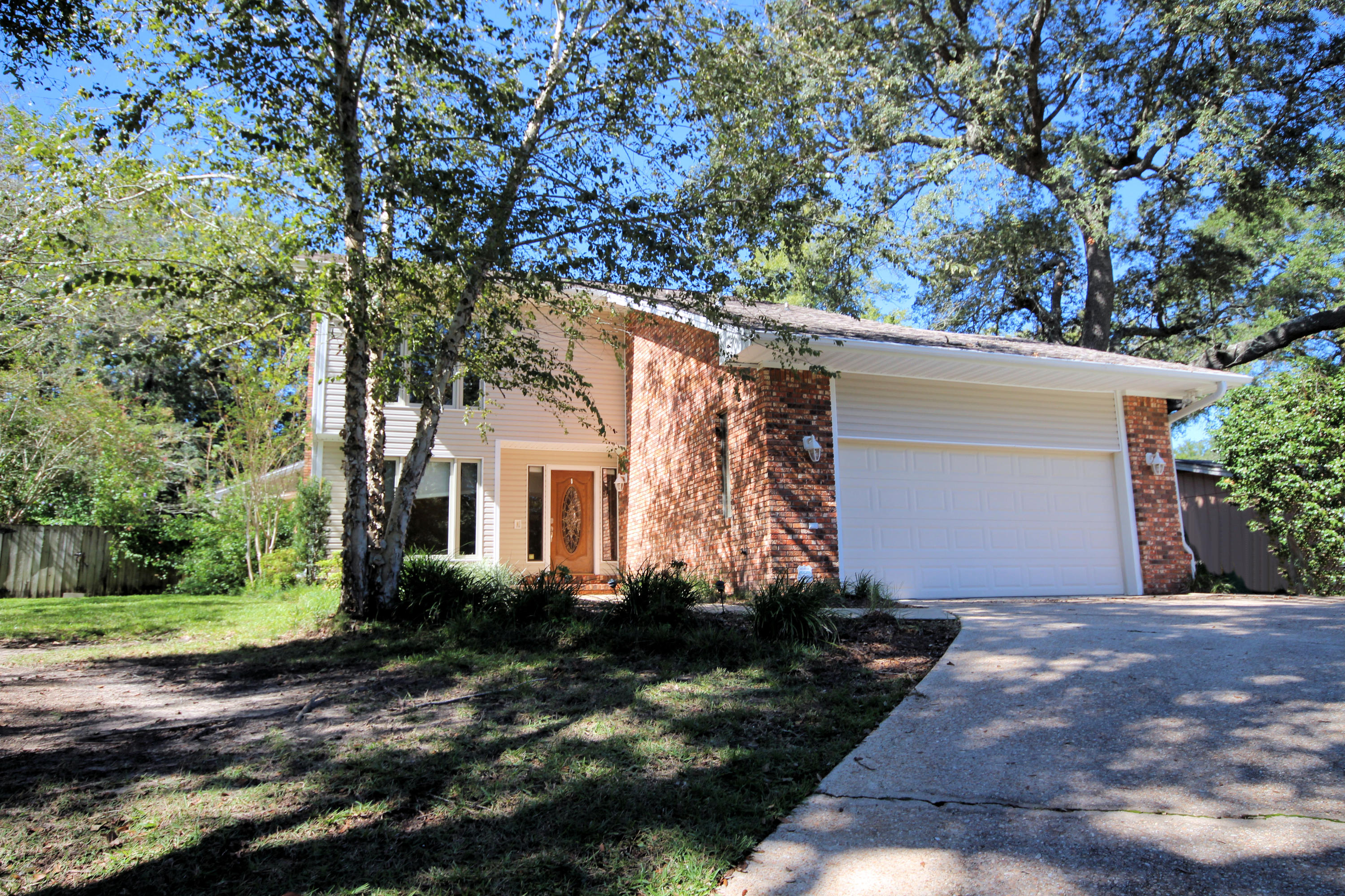 This home has it all, updated 3 bed/ 2 1/2 bath with an OFFICE, POOL and WORKSHOP on half an acre in Niceville. Remodeled in 2008 the kitchen has maple cabinets, granite counter tops and stainless appliances. This home has a nice open floor plan and tons of storage. Upstairs there are 3 large bedrooms,all with large closets. The master bathroom has a double vanity, large garden tub , tiled shower and updated lighting. There are laminate floors throughout the home. Outside is a lovely enclosed pool and covered porch. The workshop has water and electricity and has a roll up door. The large fenced yard has mature trees, sprinkler system and a storage building for yard tools. There is a double gate for easy access to workshop.