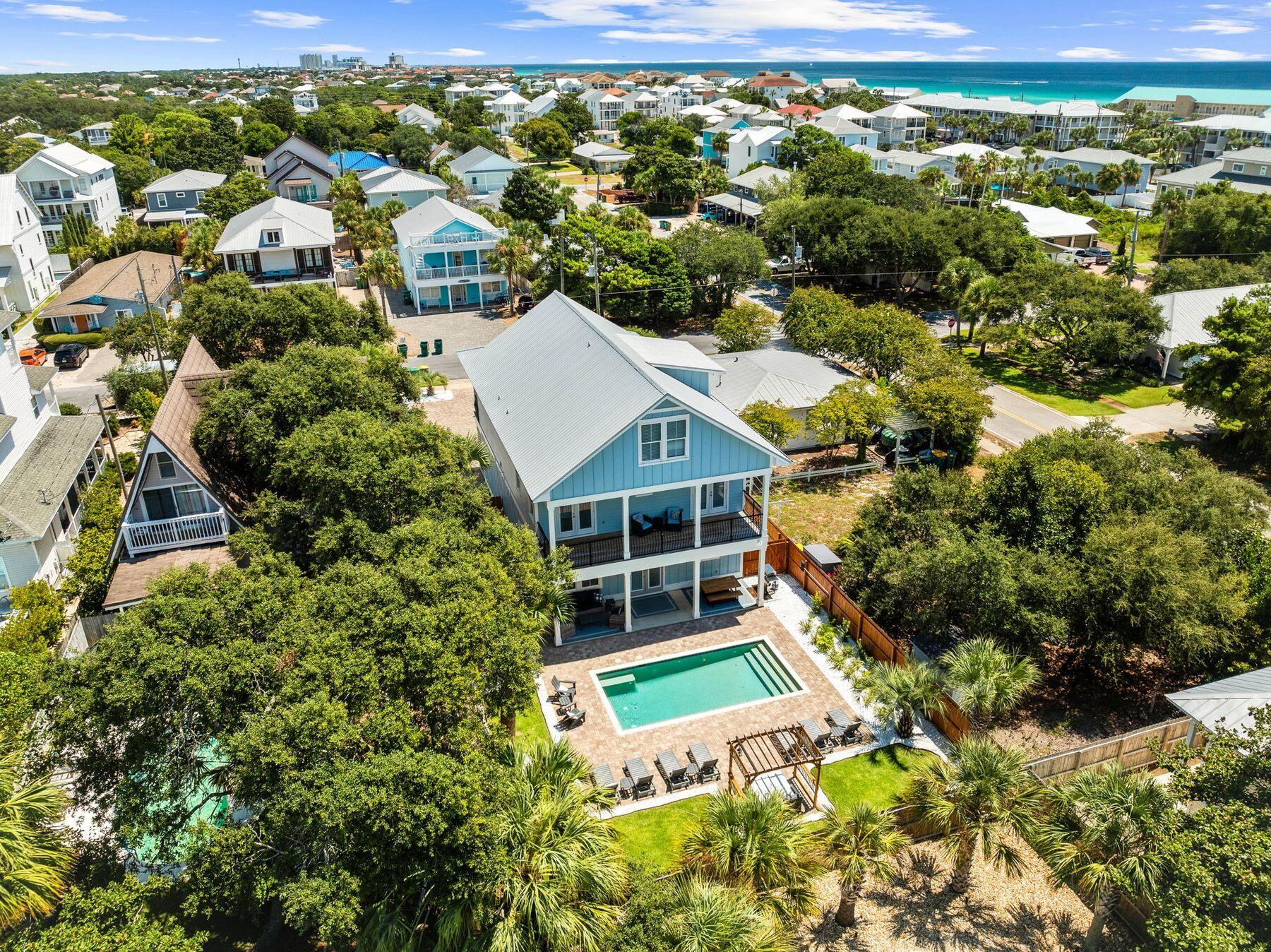 Experience this modern beach home, perfectly situated in the heart of Crystal Beach, just steps away from two public beach accesses. This stunning retreat, crafted with care and attention to detail, was completed in April 2018 and features professional decor throughout. With a total of seven bedrooms, each accompanied by its own full bath, it ensures maximum comfort and privacy. Spanning just over 3,300 square feet, this expansive residence offers abundant space for gatherings and relaxation. The main floor is designed for convenience and socializing, showcasing a fully equipped kitchen, an inviting open living room perfect for entertaining, and two luxurious king bedrooms. Ascend to the second floor, where you'll discover four additional king rooms, each with its own private balcony. This level also includes a spacious living area featuring a queen sleeper sofa, making it a versatile space. Venture outside to the generous backyard, which features a private heated pool that invites leisurely swims or sun-soaked lounging. For the culinary enthusiast, a gas grill is readily available for enjoyable outdoor cooking, allowing you to savor your meals in the fresh air. The outdoor shower provides a convenient option for rinsing off after a day at the beach, while the shaded sitting area, furnished with umbrellas and ample loungers, creates a perfect haven for relaxation. The property also boasts an oversized driveway, accommodating up to seven vehicles, with additional space available for a boat or RV, ensuring your adventures are just a step away.