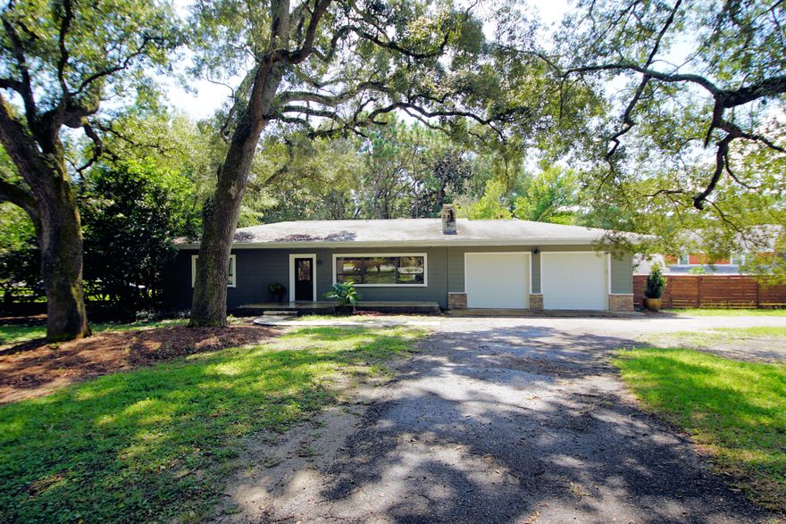 BACK ON MARKET ! Charming home in well established neighborhood 5 minutes from Eglin AFB with mature trees, sago palms and azaleas in the spring. Sprinkler system on a well. Open floor plan, cheerful breakfast room with Chicago brick flooring. Stainless appliances, large rooms with stunning craftsman touches. Cozy fireplace - lots of upgrades throughout, storage galore, best ''man'' shed EVER out back! Even though in Great condition, being sold in ''as is'' condition and Seller offering Home Warranty for buyer's peace of mind. Just under 1/2 acre corner lot and short walk to Longwood Park. Set appt to see it today!