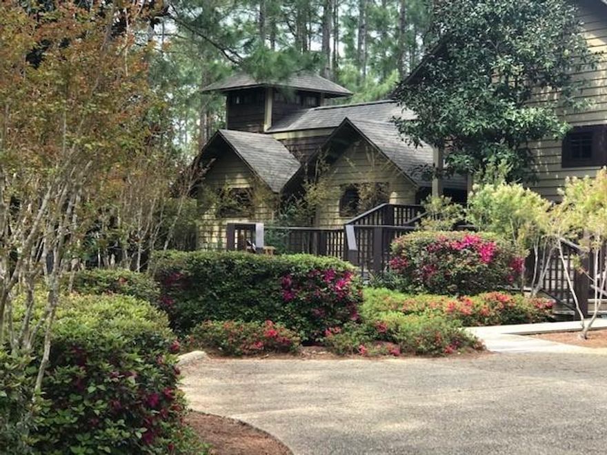 Own your own private resort-like oasis and spa as you cross your own private bridge into a secluded sanctuary. This exquisite, custom built and hand crafted luxury home, has impeccable architectural characteristics and comes complete with the utmost details, including a 10 foot mahogany front door, slate flooring through an impressive foyer which gives way to a two-sided gas fireplace with a custom mantle between the grand dining and living rooms that showcases beautiful hardwood flooring, tremendously high ceilings that complete the whole house, floor to ceiling windows in the massive living room that overlooks the backyard oasis, a resort style pool with a custom stone waterfall and planters and the many decks that overlook the 8th hole of the acclaimed Greg Norman's Shark's Tooth Golf Course. The gourmet kitchen boasts Sub Zero refrigerator/freezer, Wolf gas six burner/double oven with Viking pro series range hood, two Asko dishwashers, a sub-zero wine cooler and the kitchen boasts a 12'x4' large marble island. There are cedar lined master closets off of the magnificent master bedroom and the master bathroom features tile floors, deep garden tub, a large glass shower with body sprayers, back-to-back travertine vanities and a unique double-sided mirror. There is a beautifully custom mahogany spiral staircase that leads to an extra bedroom or study and two guest bedrooms with ensuites are located on the other side of the house, giving everyone privacy and access to the backyard. More upgrades include a fully finished, climate controlled two-car garage plus separate golf cart garage, two Rinnai tank-less water heaters, copper gutters, 8' tall solid wood doors, media room with electronics and Sonos System with speakers throughout. The Gated Wild Heron community has a gorgeous pool, Fitness Center and Boat House on Lake Powell for everyone's enjoyment. This famously known gated community is just minutes from Rosemary Beach, 30A, six miles from the future University Hospital and only a mile and a half from the beautiful Gulf of Mexico!