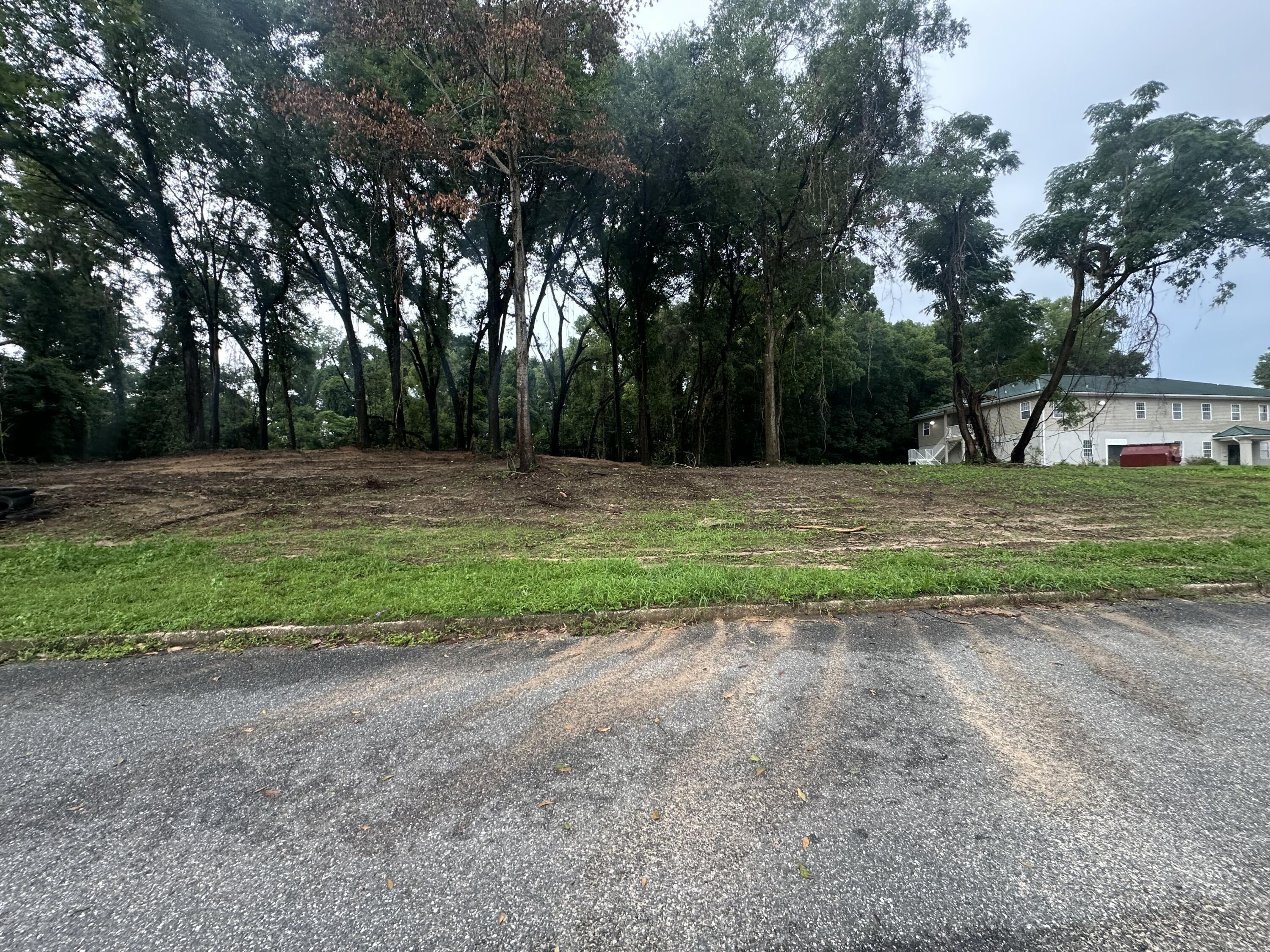 Three parcels totaling approximately 0.61 acres with C-1 Commercial Low-Intensity zoning along Spring Street in Crestview. Located within city limits with paved road frontage and access to public water and sewer. Permitted uses may include office, retail, or multifamily development (up to 15 units, including apartments or condos, per city guidelines). Surrounded by a mix of residential and commercial properties. Buyer to verify all zoning, use allowances, and development requirements with the City of Crestview. A unique opportunity for new construction or investment.