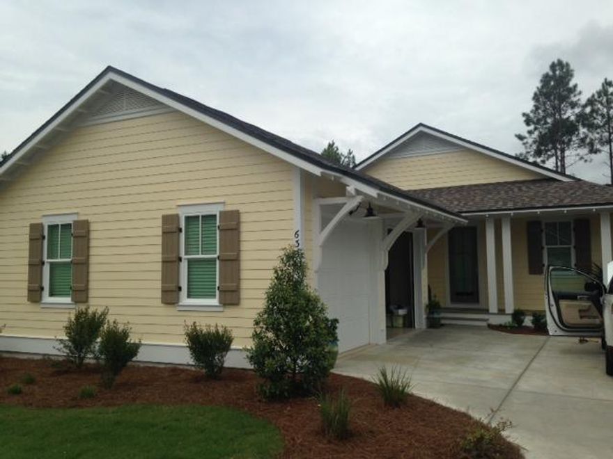 This expanded Bayberry plan offers three bedrooms, three baths, an open concept design, and a two car garage and all on one level. Interior finishes include stone countertops throughout, stainless appliances, soft close cabinets, wood floors, travertine in bathrooms, crowing molding in common areas, and impact resistant doors and windows throughout.