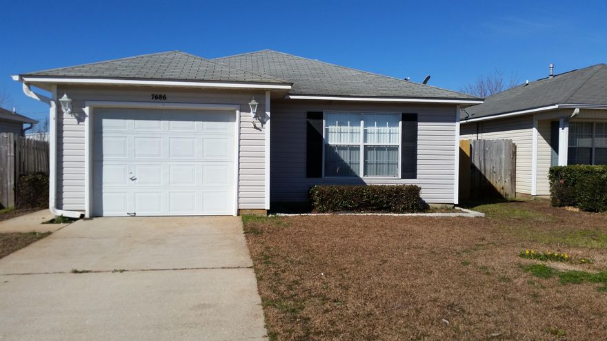 Cute home just a short drive to beautiful beaches and ready for immediate occupancy. Convenient to Hurlburt Field AFB to the East and not far from Pensacola to the West. Open floor plan with pretty tile floors throughout. Large living/dining with sliding door to 10x10 open patio. Master is separated from other bedrooms and offers garden tub in bath. Privacy fenced lot with lawn pump and sprinkler system. Garage has pull down stairs to access attic storage and electric garage door opener. This home is immaculate and has been freshly painted including the garage. New light fixtures in breakfast area and baths and new ceiling fans. This home is move in ready.