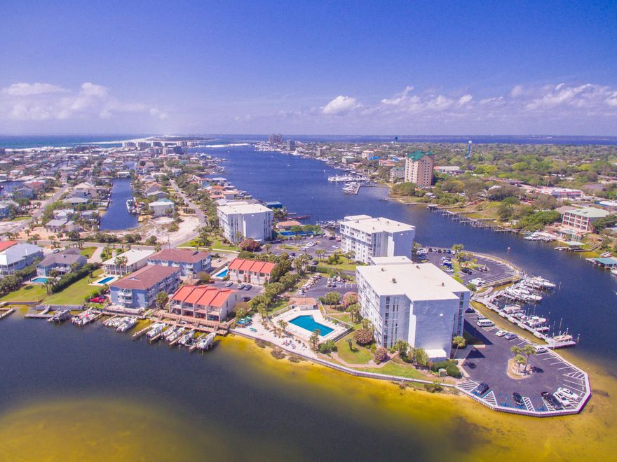 This fully furnished and recently renovated ground floor unit with harbor views is an opportunity to own a piece of paradise in the very popular community of Holiday Isle.  Relax in the sunroom and enjoy all that harbor life has to offer, big fishing boats going out to the gulf and the small family cruisers having fun, wildlife aplenty including dolphins, osprey, heron and fish.  The open floor plan and large bedrooms with lots of storage optimize comfort and space.  The following improvements have been made:  the entire unit was recently painted, new luxury vinyl hardwood flooring, new carpet in both bedrooms,  new light fixture in the dining room, new HVAC unit, master bath has new shower, tile, plumbing fixtures, and glass doors, 2nd bath has new shower doors, and the sunroom has 2 new
