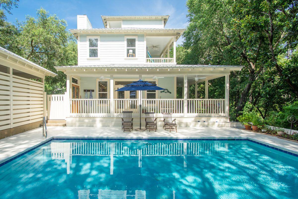 Located off scenic 30A in the peaceful community of Seabreeze, this custom 3 level beach cottage exceeds expectations with a private pool, wooded lot, main level bedroom, proximity to the beach and gracious indoor and outdoor living.  Close by are the upscale beach towns of Alys Beach(1 mile) and Rosemary Beach (2 miles). Seaside and WaterColor are 6 miles to the west. The home sits next to a conservation area on it's north side to give it a more secluded feel. A private pool sits to the rear of the home which can be enjoyed from it's large covered porch. The primary bedroom suite has a large walk-in closet. In addition to the 3 bedrooms, the 3rd level can be used for another bedroom, a bunk room or an office.