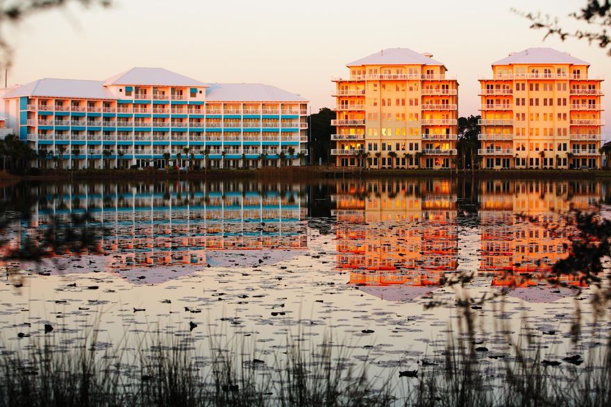 The Sunrise and Sunset luxury condominiums look over the shores of Lake Carillon and the Gulf of Mexico. This spacious 1st floor unit has upgraded finishes, appliances and innovative floor plan. It is the perfect answer to your quest for a private vacation space, a rental property or a full time residence. These condos are only minutes from the NW Florida Beaches International Airport, Pier Park and Frank Brown Aquatic Center. The covered porches afford maximum relaxation and entertaining possibilities. As an integral part of Carillon Beach, the condos have access to all amenities including almost a mile of dazzling sugar sands beaches, four pools, tennis courts, basketball court, and playgrounds.