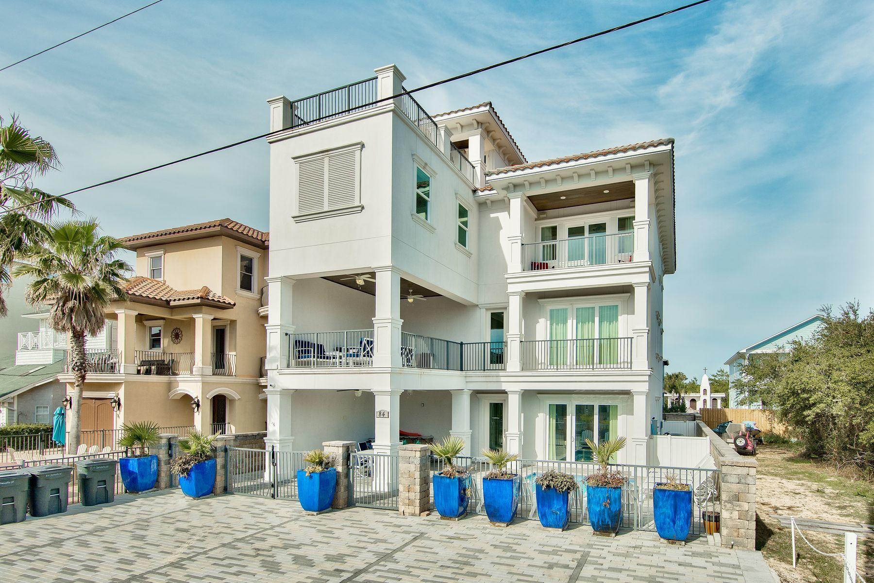 The grandeur, beauty and magic of an exquisite lifestyle are all present in this magnificent seven-bedroom, eight-bath home. The one block walk to deeded beach access takes mere minutes. Cruising up to your fourth floor rooftop deck with coffee and a croissant, wine and cheese, family and friends or for a solo view over the emerald green waters of the Gulf of Mexico soothes and refreshes everyone. In three stories of fine craftsmanship and thoughtful design, this home offers sleeping space for 24, a glorious media room with a wet bar and large first floor entertainment and game area. First class is a way of life with no HOA fees and 1,000 square feet of outdoor deck space. The classy pool and spa by Watermark Pool & Spa is heated and flanked by expansive paver patio space, covered and