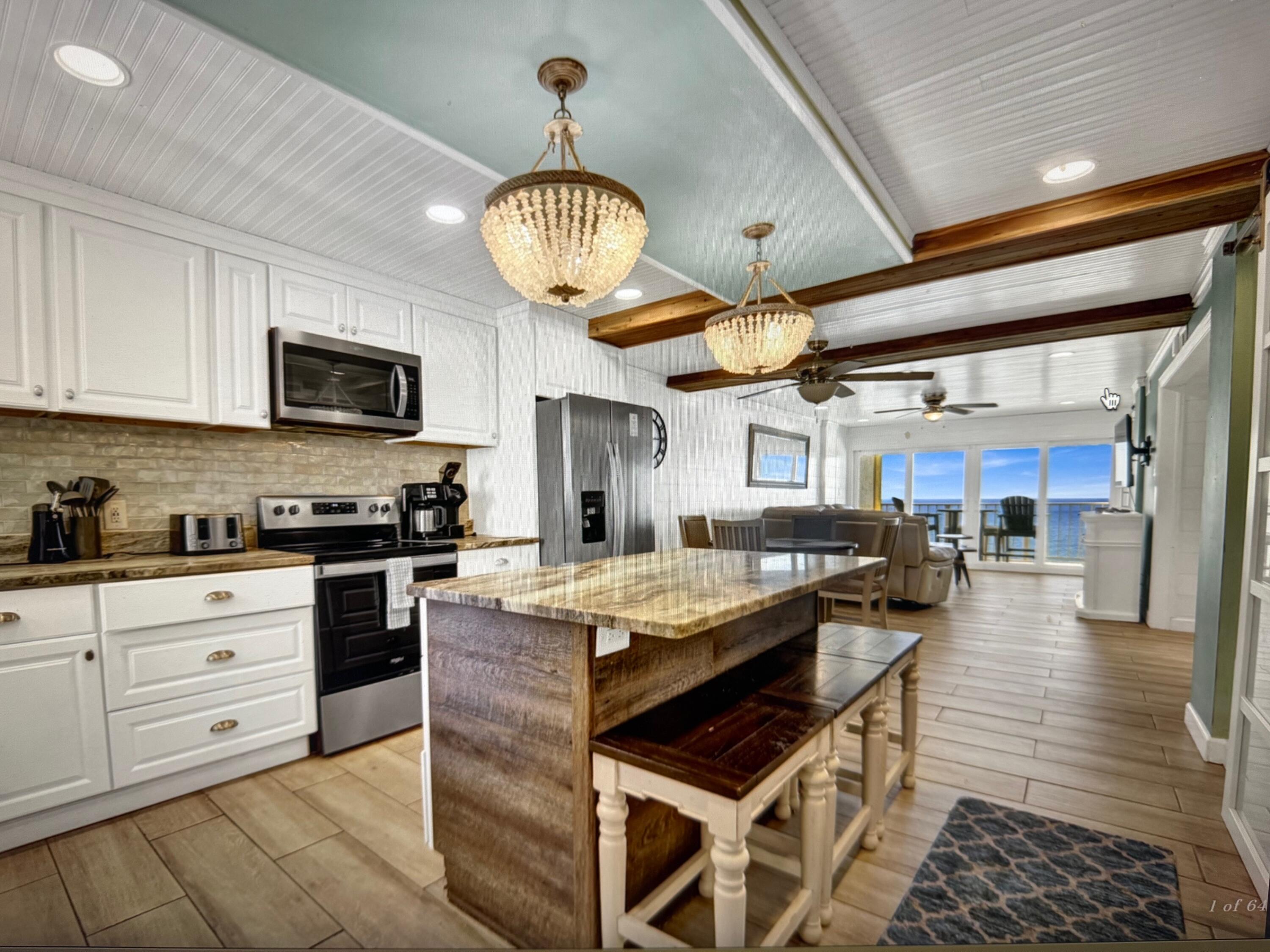 This beach condo includes an updated kitchen with a farmhouse sink and a beautiful backsplash, an updated primary bath with a jacuzzi tub with glass enclosure, and last, but not least, an updated guest bathroom with a walk-in shower with a rain head and body jets and glass enclosure. This condo is a fantastic rental and a place your family will enjoy coming to for years. Located near St. Andrews State Park. Come relax and the balcony and enjoy the gulf breeze!