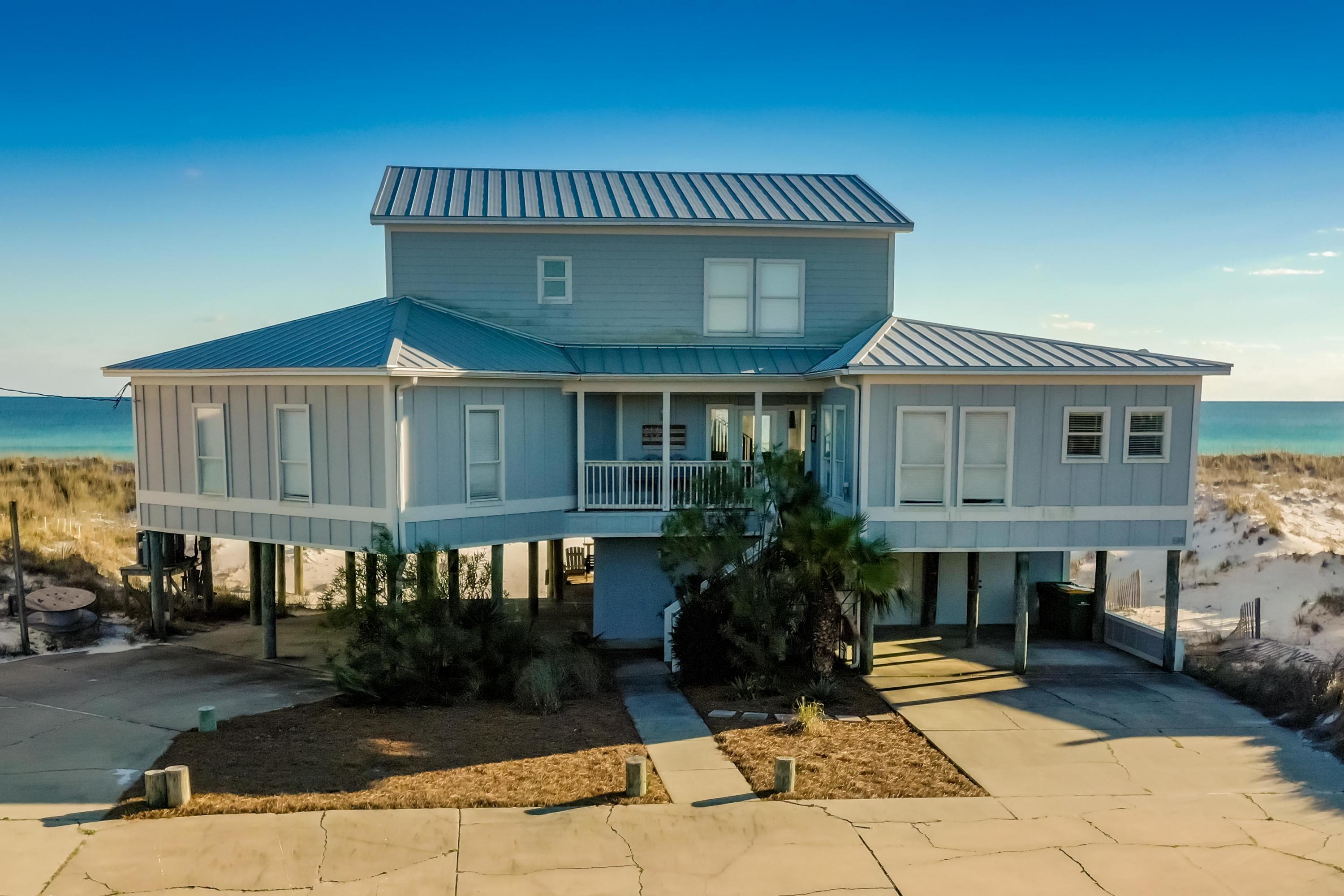 Property is under contract with a 72 hr kick-out clause. Enjoy breathtaking views from this Gulf Front beach house with an expansive deck on the back of the home. Situated on a HUGE lot on Holiday Isle, offering a 100 ft on the Gulf of Mexico and lot depth of approx. 400 feet. This home features four bedrooms on the second floor and 3 updated bathrooms, kitchen, dining room, living room and a flex room that is being used as a den currently. The entire upstairs is one huge entertainment room featuring a seating area, game room, extra sleeping space, another fully updated bathroom, deck and windows facing to the east, south and west offering more incredible gulf views.