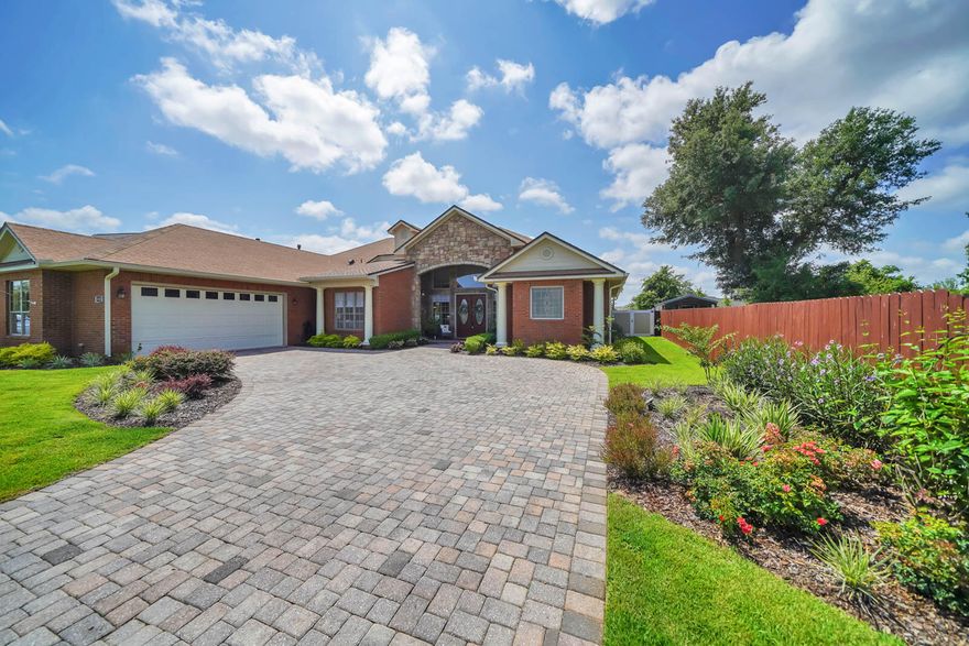 Welcome home to this luxurious semi-custom all brick with stone accent home that is located on a culdesac and has an expansive lot with a fully-fenced in backyard. This home has an incredibly large entryway that enters into a colonial style great room and an open, split floor plan. You are going to be in shock when you see how much natural lighting encapsulates the space of the main living area. The great room is perfect for entertaining and has built in bookcases, a gas stacked-stone fireplace, and luxury vinyl plank throughout. The coffered ceilings, recessed lighting, and custom entryways are going to make you feel like the character is true luxury and upper echelon quality. You will notice the functionality and quality go hand in hand, and the space is being used in the very best way.