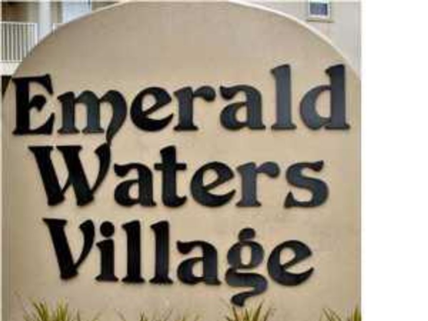 Located in Emerald Waters Village this lot is just a short walk to the beach. This gated community has amenities that include a deeded beach access and two community pools. This lot offers very unique access with front and side entries. This type of access allows a buyer to build a home with multiple features and allow the builder better access to build. Speak with agent for more details! Short term rentals are allowed and do very well. This great opportunity to build a vacation rental home or a place to call your own awaits you. Tap fee is paid on lot.